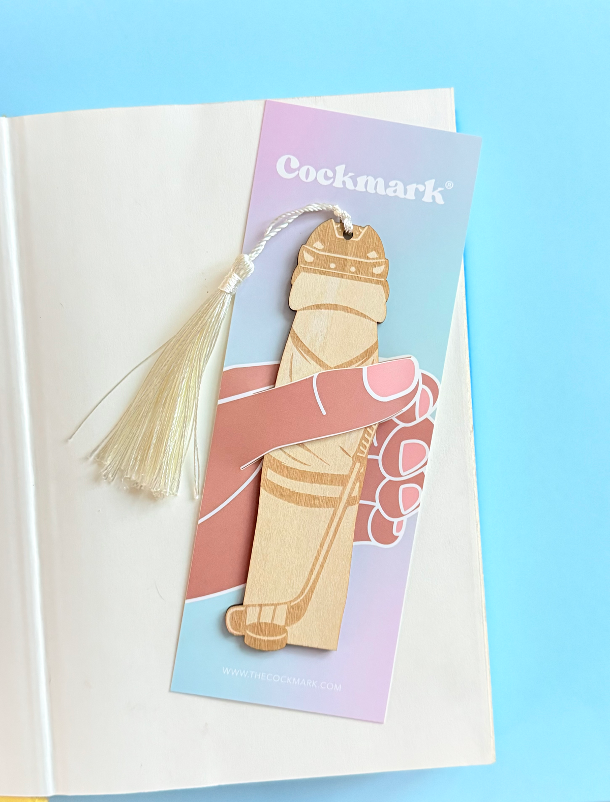 Bookmark with tassel on a pastel background