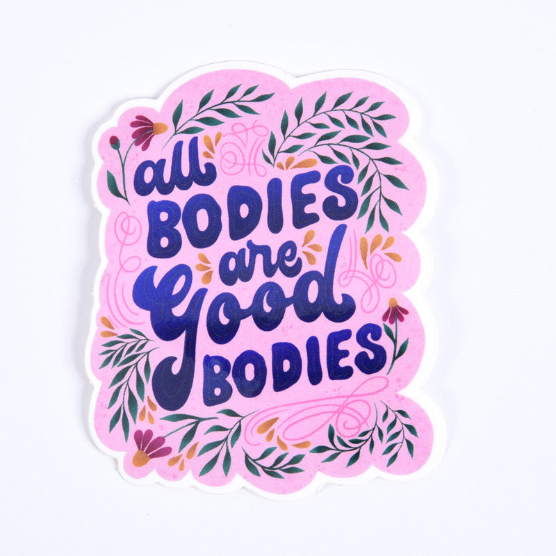 A sticker with a pink background and a green floral pattern, featuring the text &