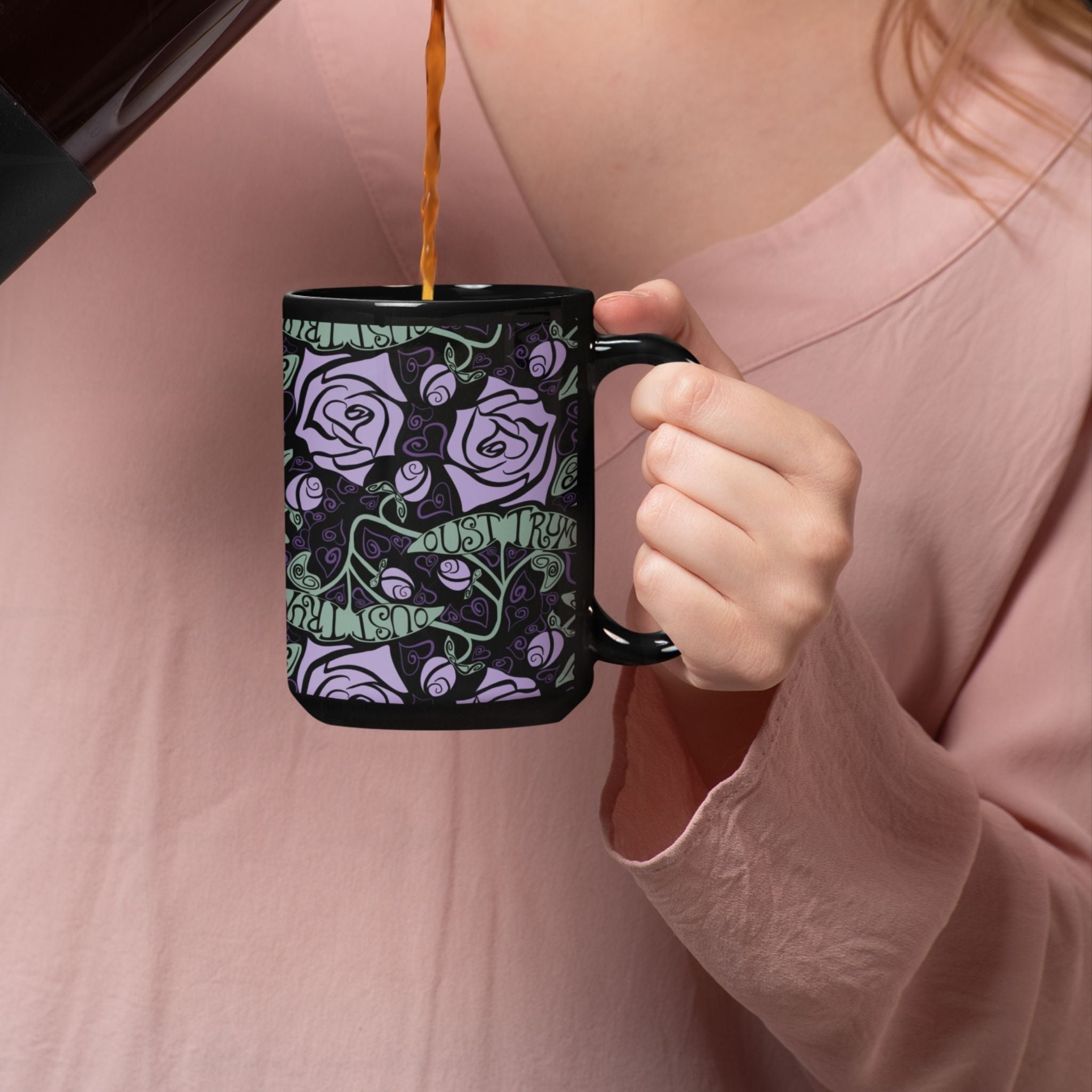Person being poured coffee into anti-Trump hidden message mug with dark botanical rose print