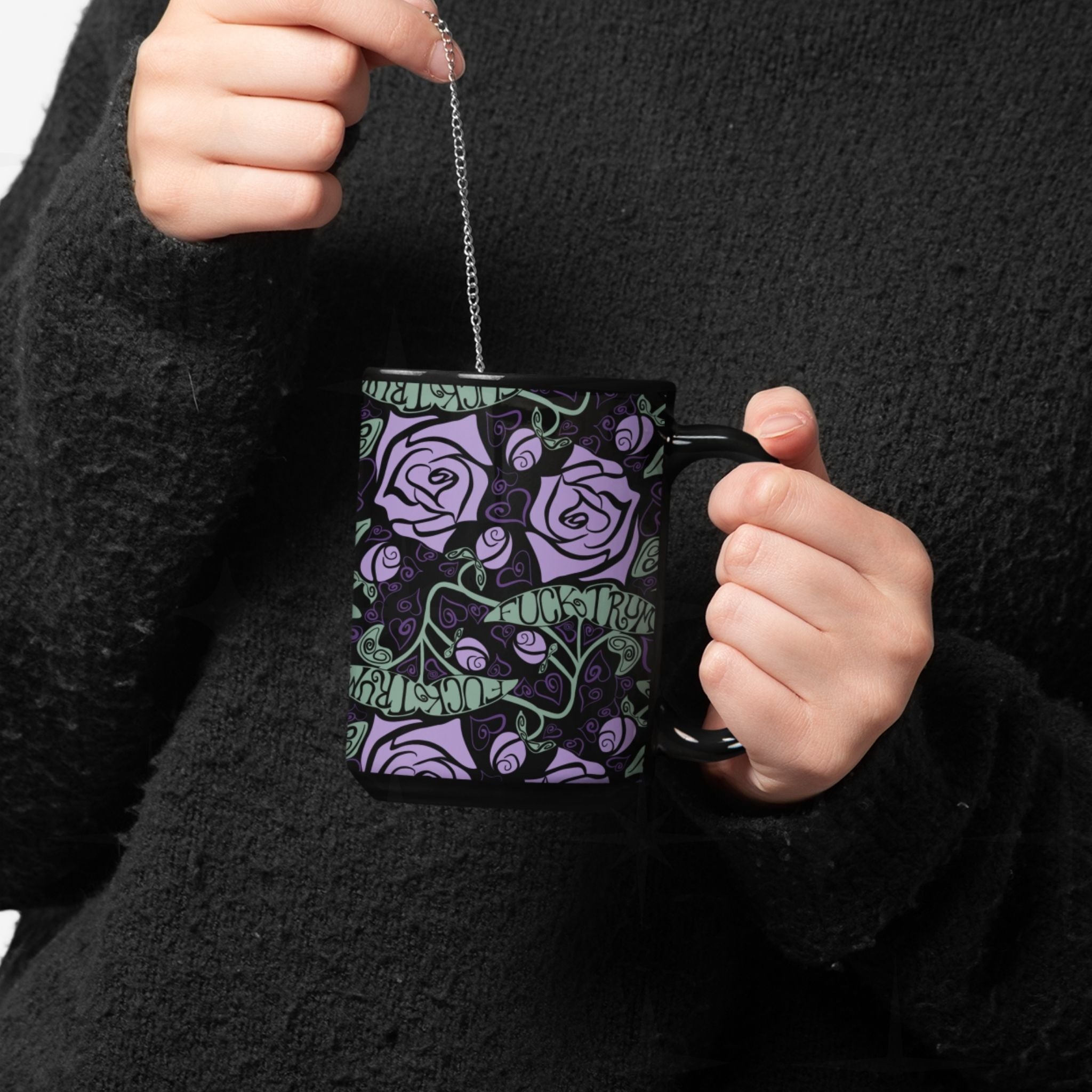 close up of woman steeping tee in a fuck trump hidden message mug