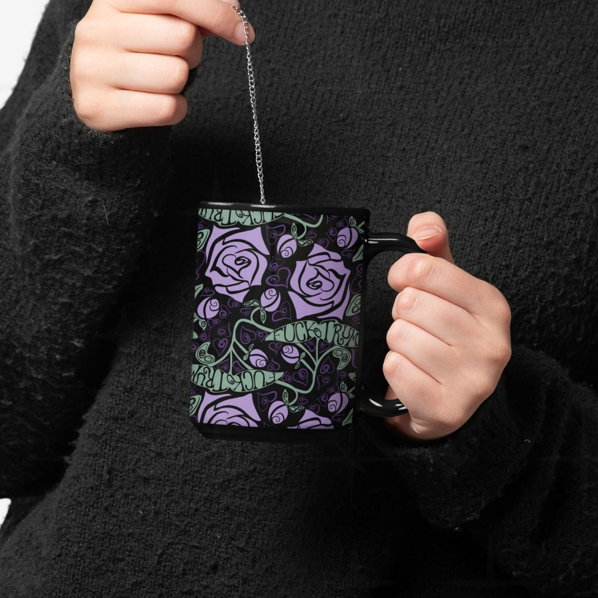 close up of woman steeping tee in a fuck trump hidden message mug