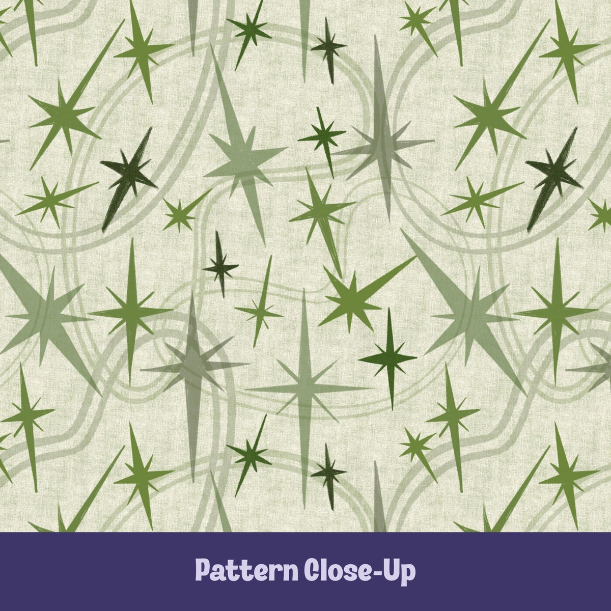 Close-up of the olive and sage green atomic starburst pattern on a warm cream background showing freehand-illustrated starbursts in multiple sizes with sweeping orbit curve details