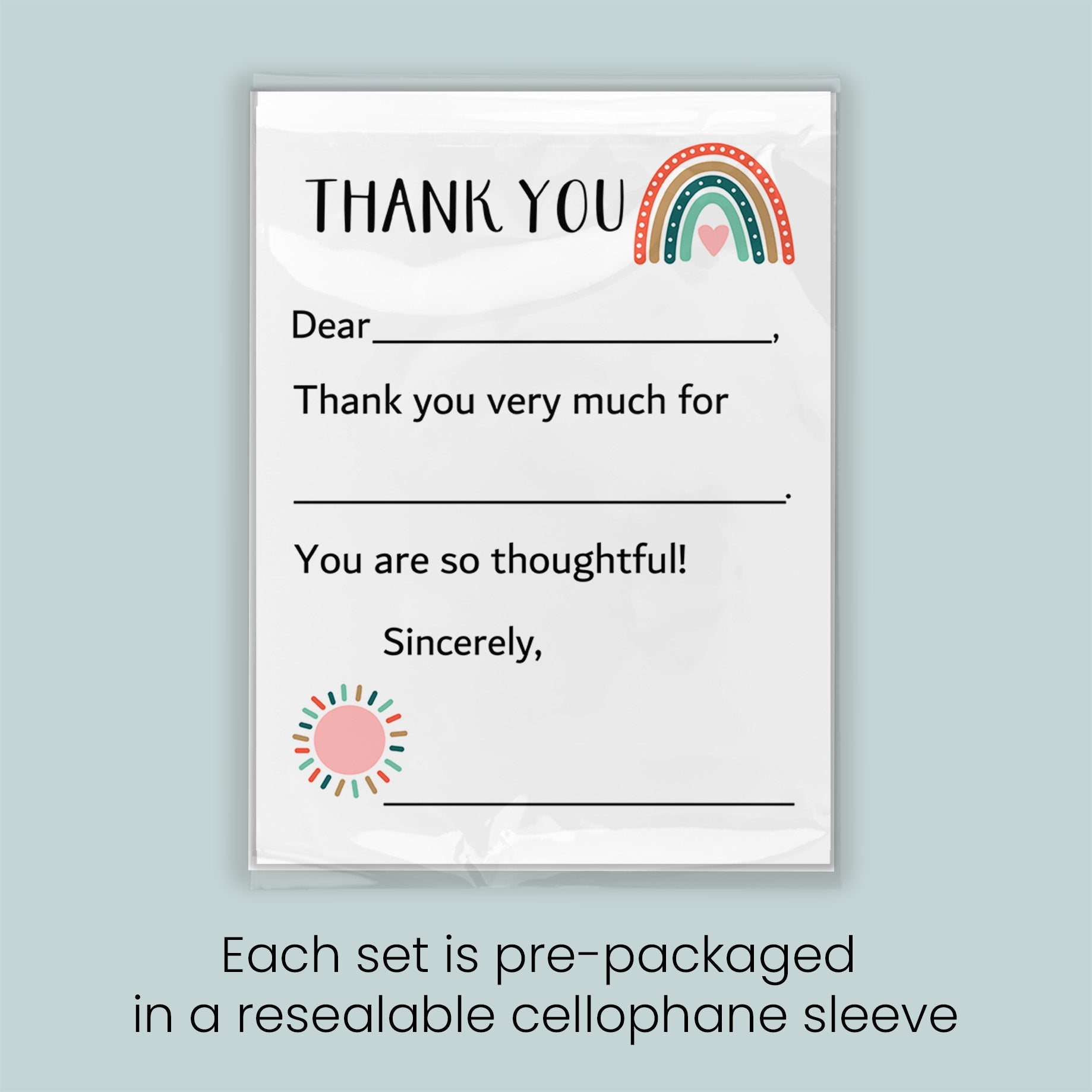 The image is a thank you card with a rainbow graphic and a heart symbol. The card is pre-packaged in a resealable cellophane sleeve.