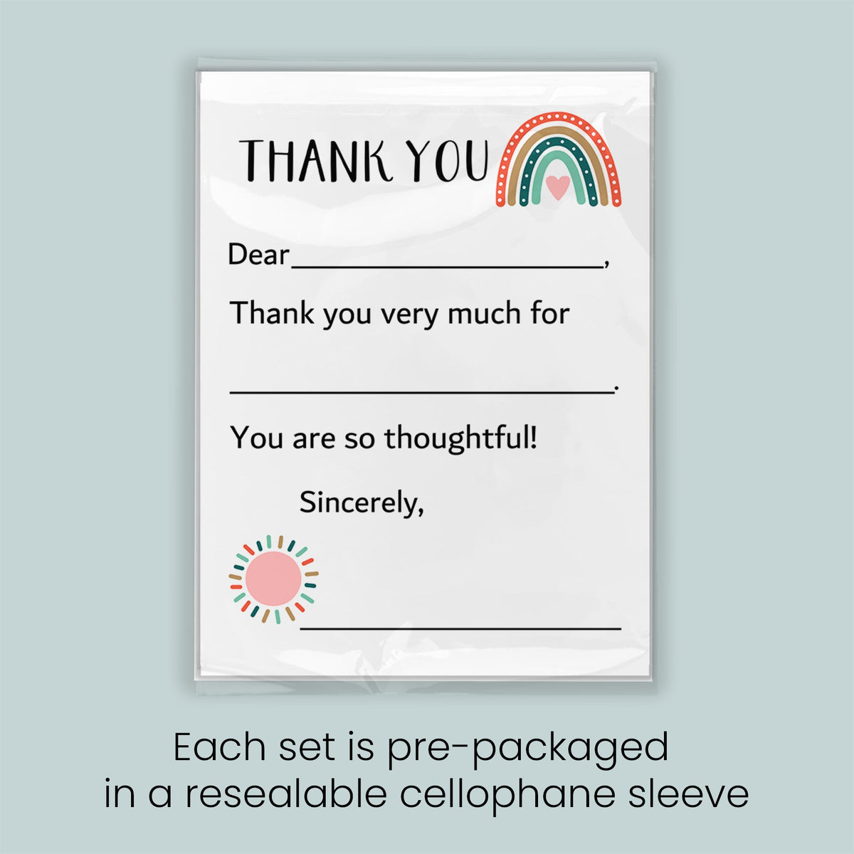 The image is a thank you card with a rainbow graphic and a heart symbol. The card is pre-packaged in a resealable cellophane sleeve.