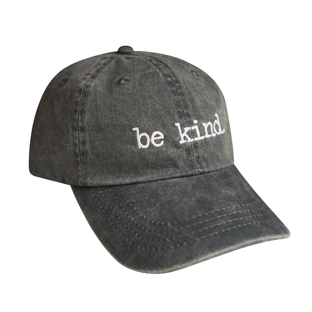 Faded black cotton dad hat with white "be kind." embroidery and a relaxed, vintage-inspired look