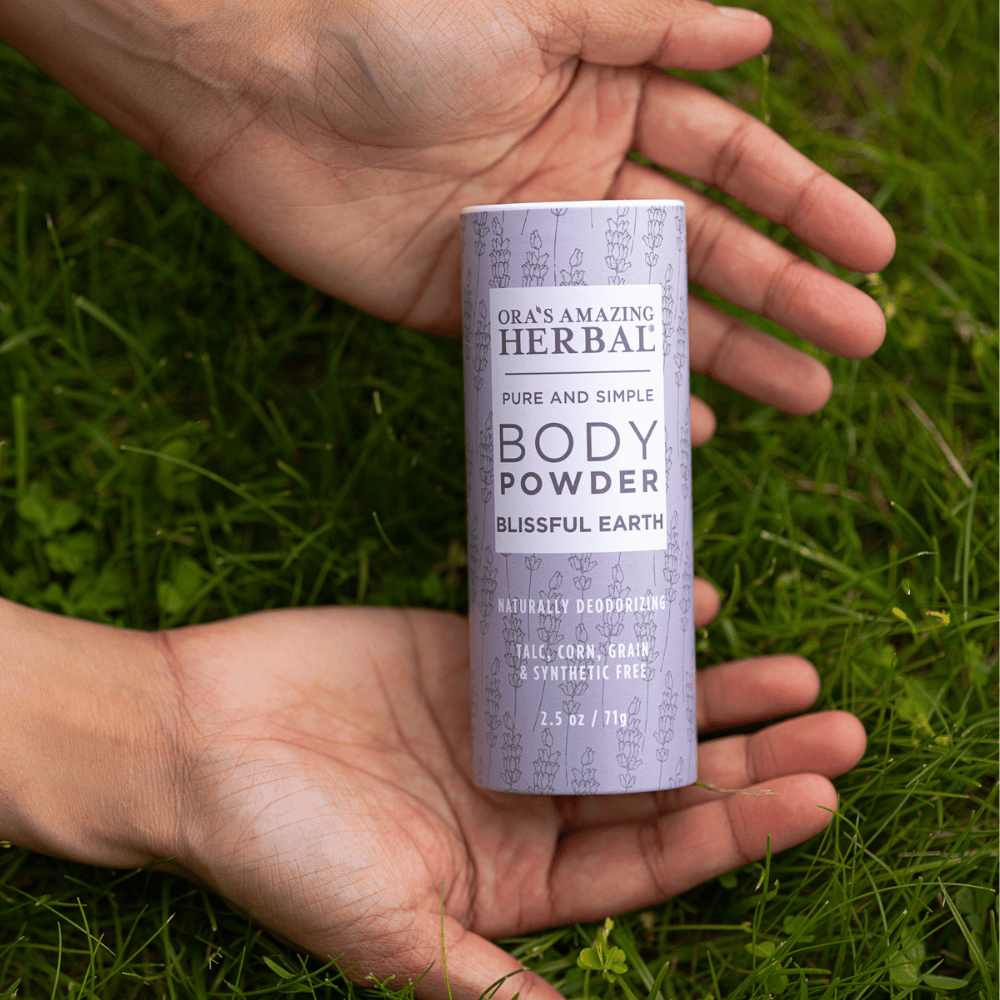Blissful Earth Body Powder 2.5oz Lifestyle Human Hand Outdoor Square