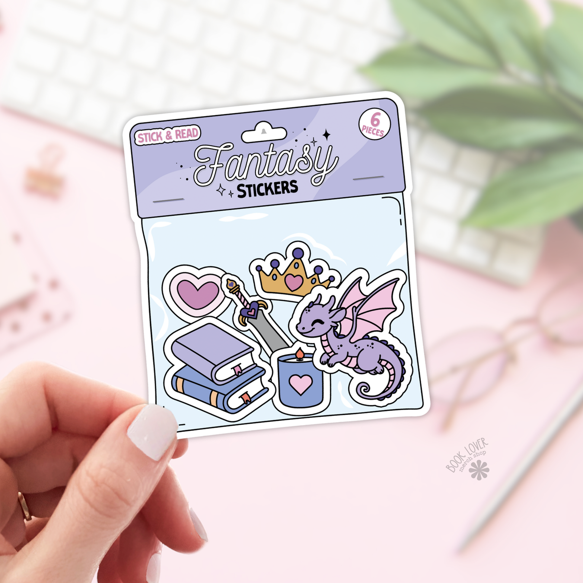 Pack of fantasy stickers with a purple dragon, castle, and other elements on a light pink background.
