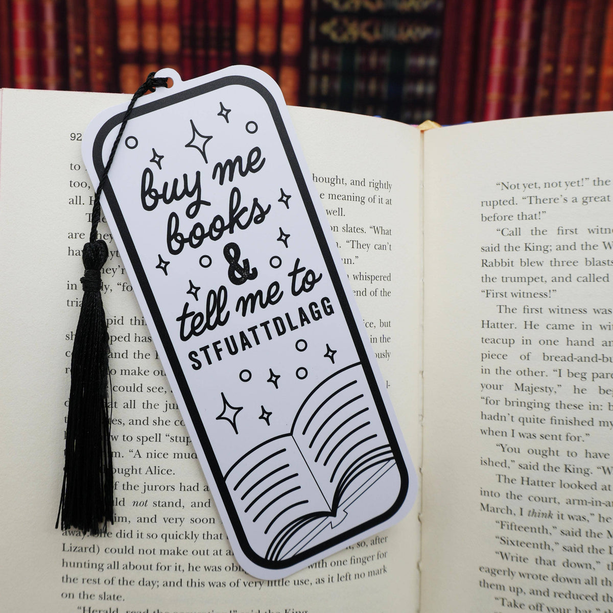 Bookmark with text and tassel on an open book