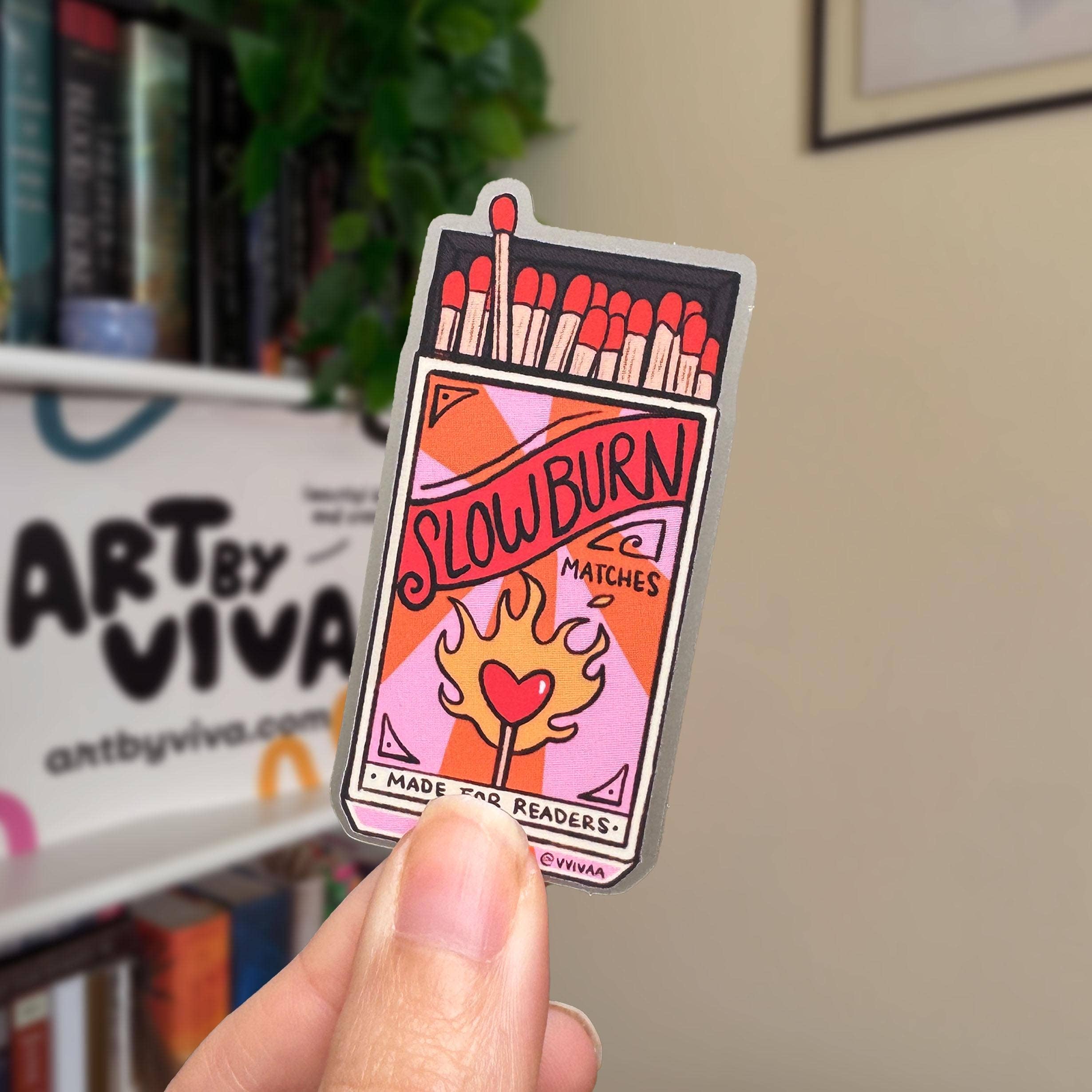 Sticker of a matchbox labeled &