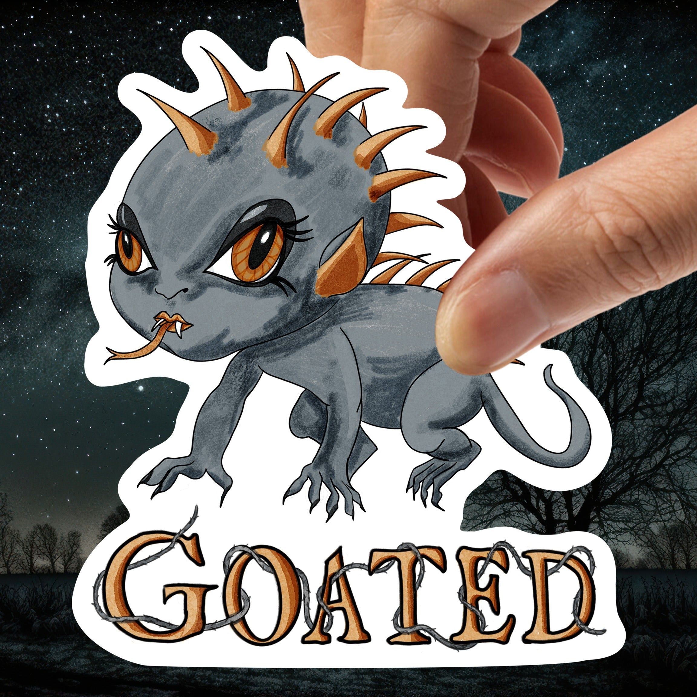 Hand holding the chibi chupacabra sticker against a starry night woodland background