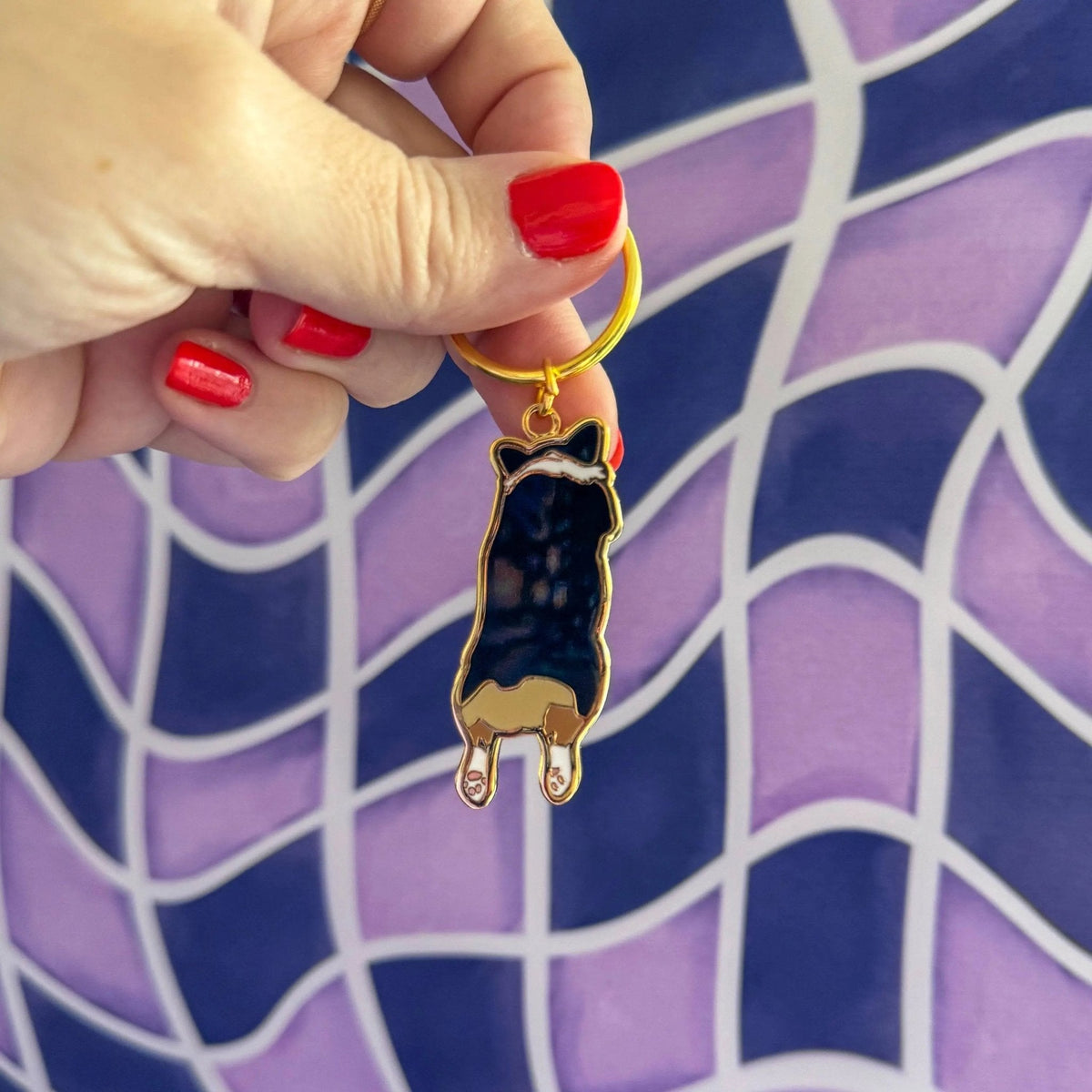 Corgi Sploot enamel keychain detail — close up of the tricolor corgi illustration in hard enamel by indie artist MangoIllustrated