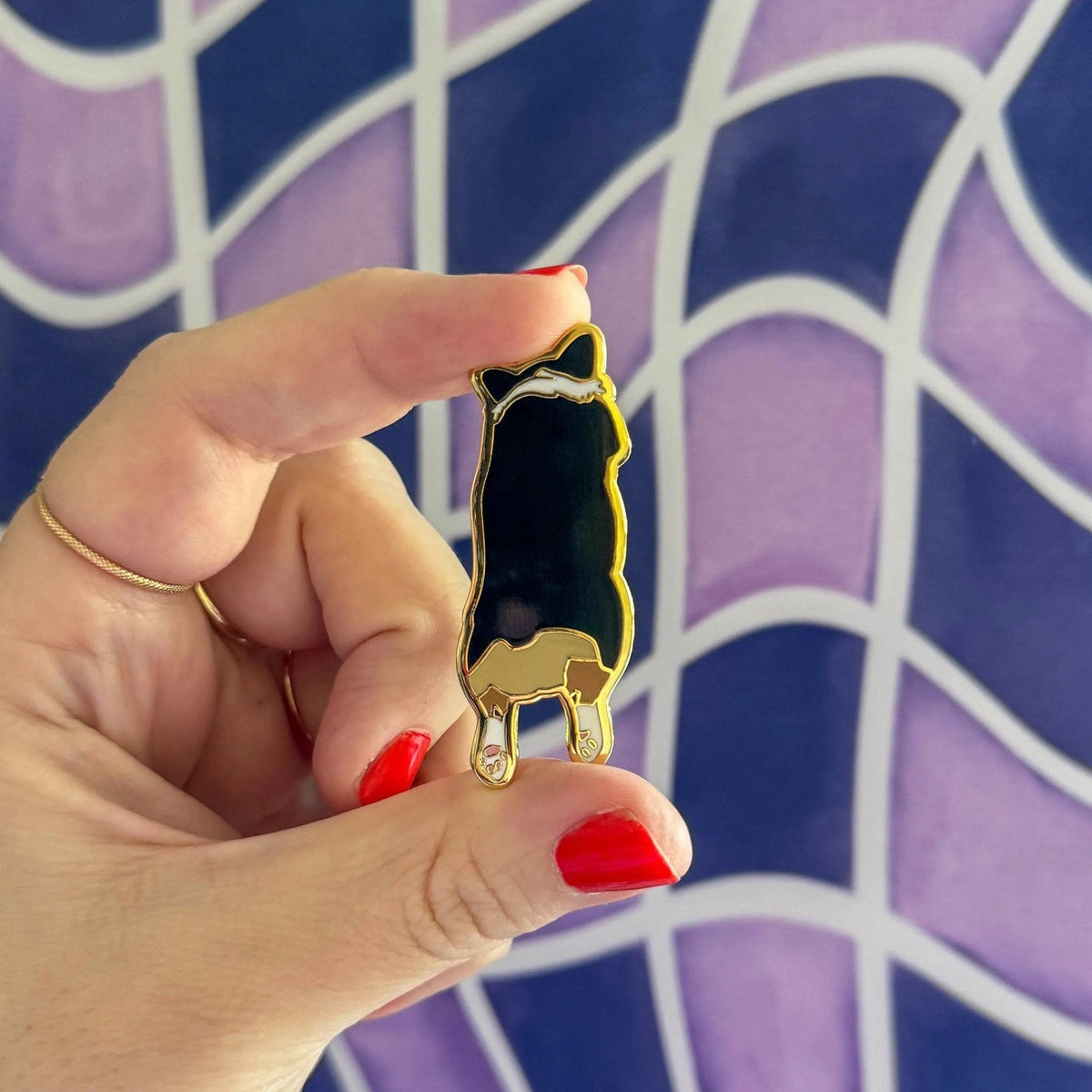 Corgi Sploot enamel pin flat lay — corgi butt hard enamel lapel pin by indie artist MangoIllustrated