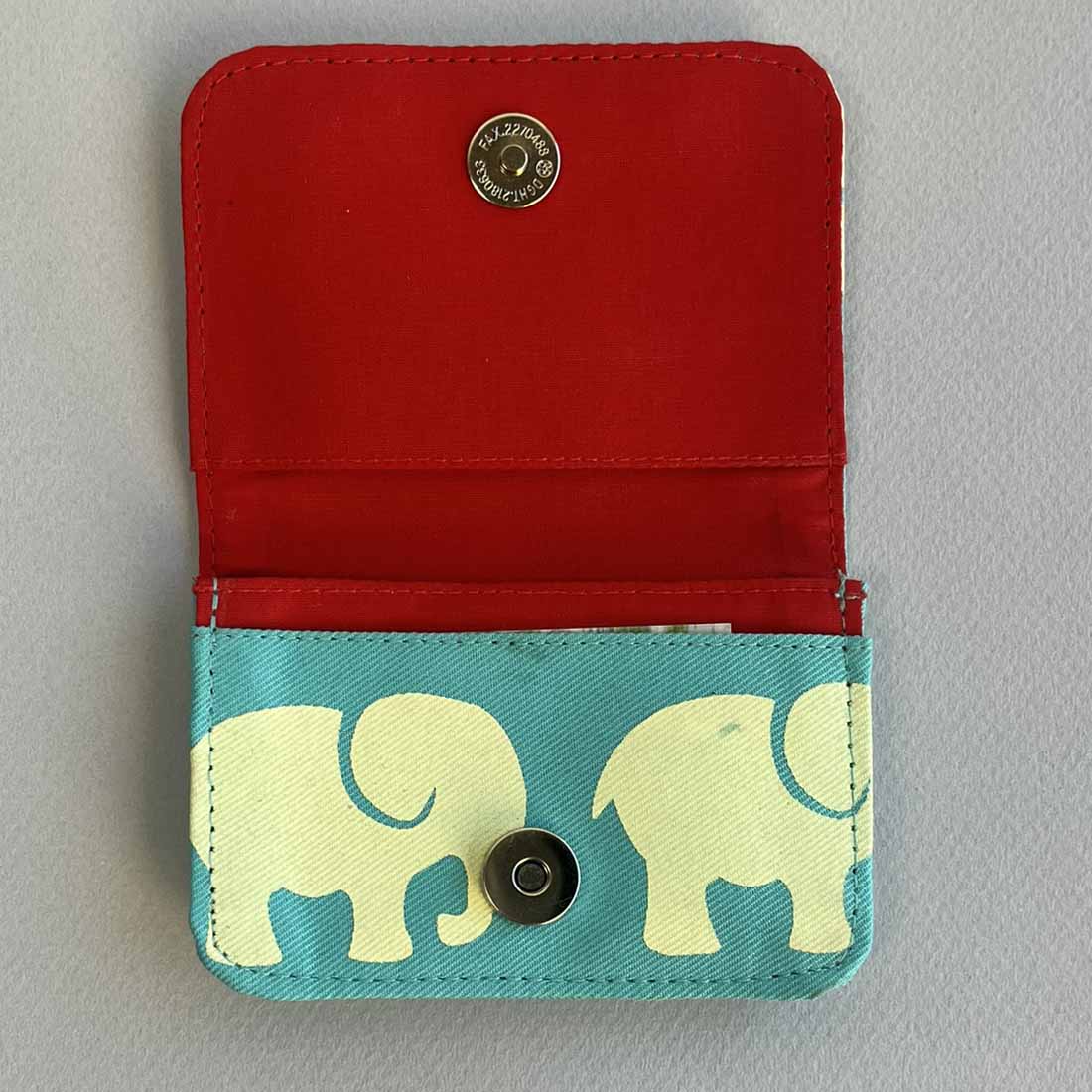 interior of fair trade cotton canvas cardholder with bright teal elephant