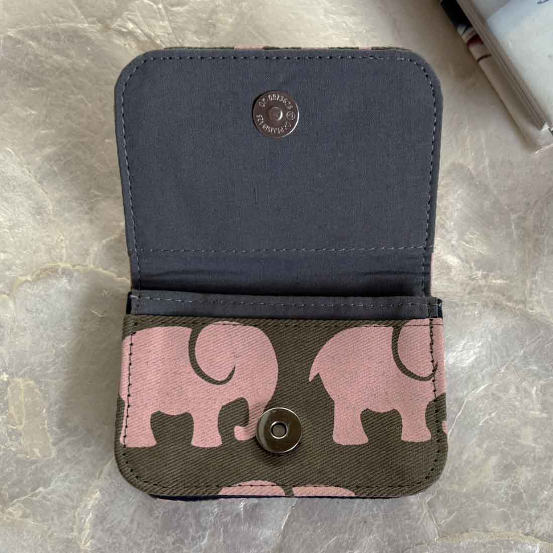 interior of sustainable cotton canvas cardholder with army green and peachy print elephant