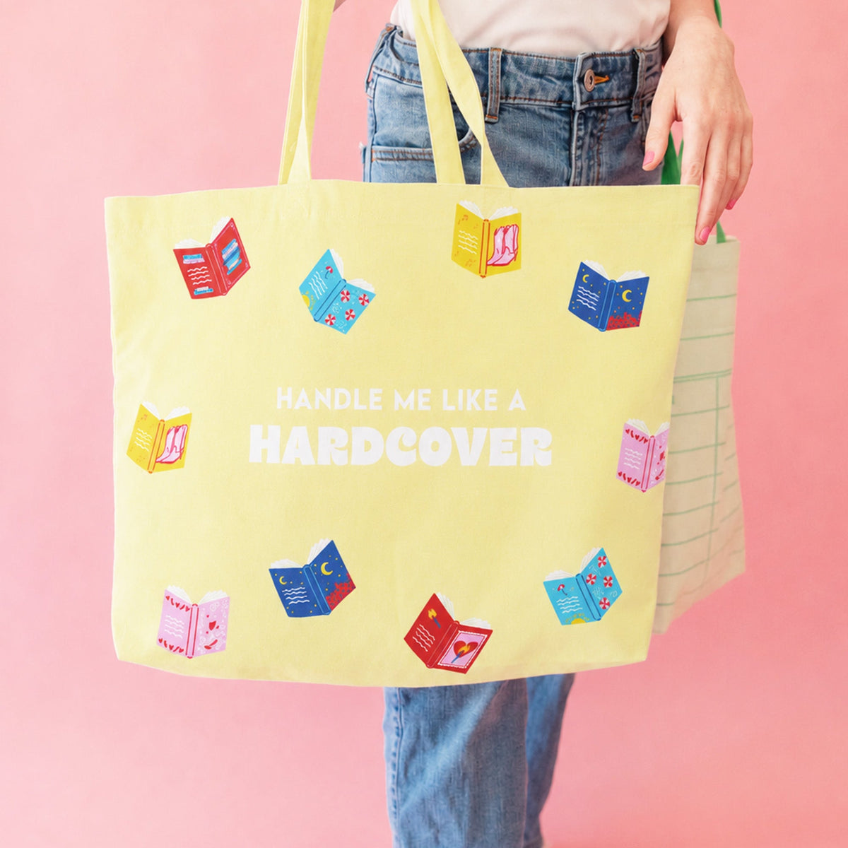Handle Me Like A Hardcover canvas tote lifestyle shot with books and literary accessories, Jollity & Co.