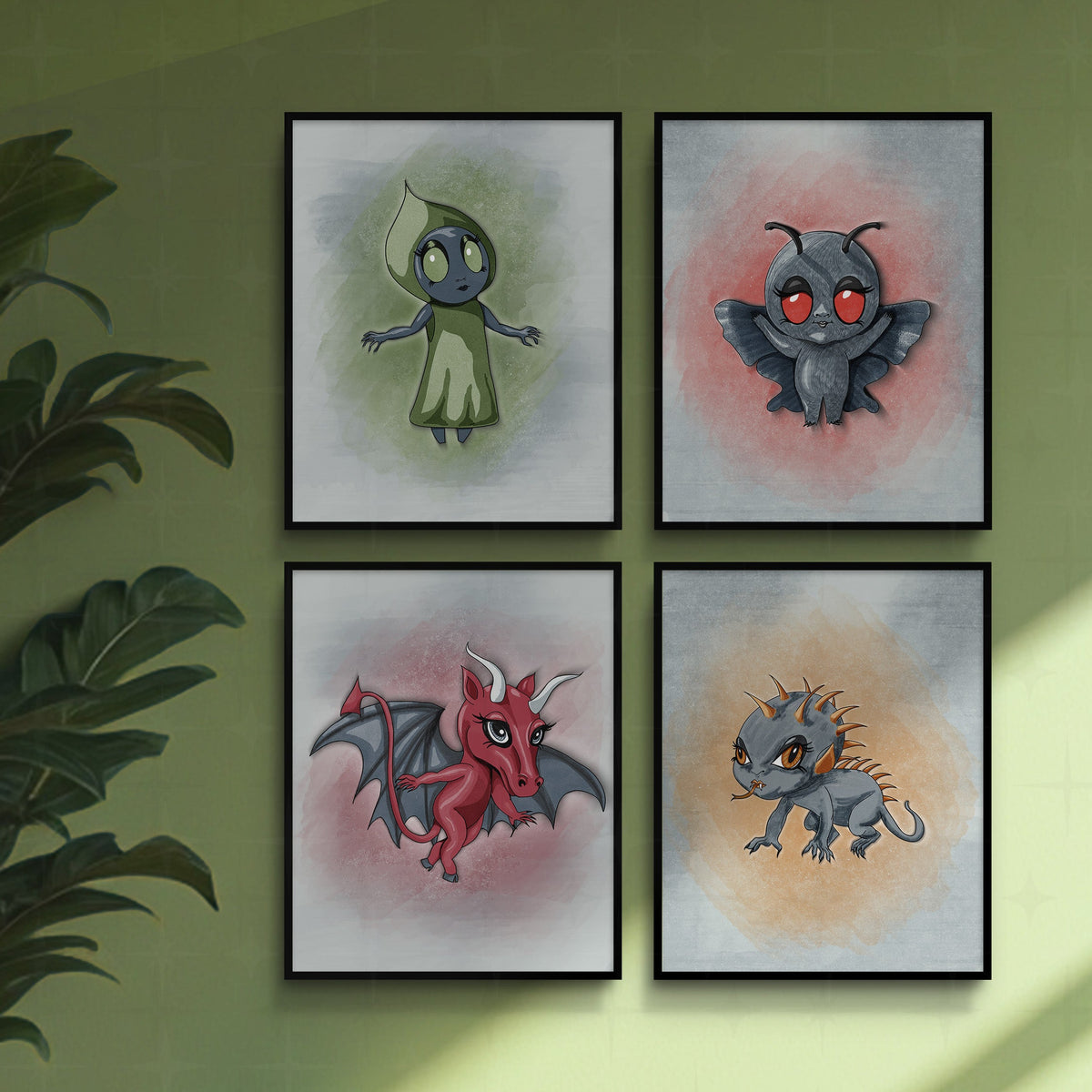 Set of 4 cryptid art prints in thin black frames on a sage green wall beside a leafy houseplant, arranged as a square gallery wall.
