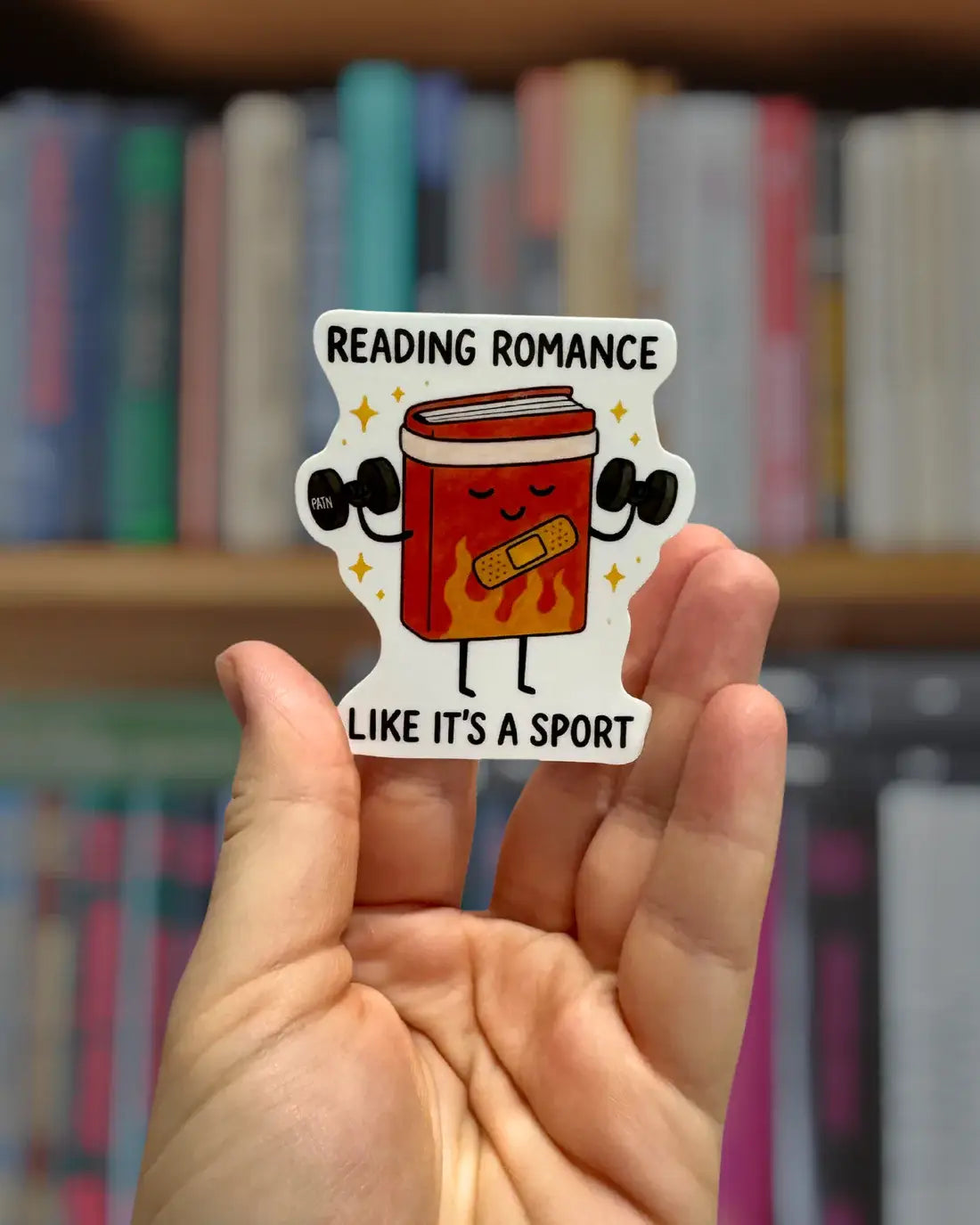 Sticker with a cartoon book character and text &