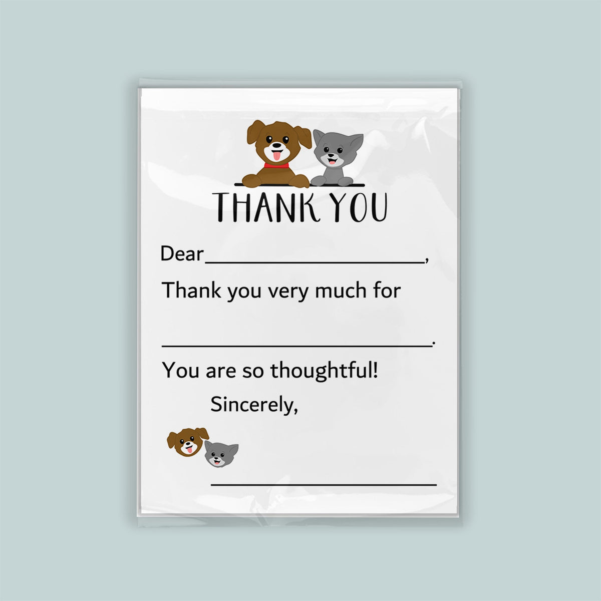 The image is a white thank you card with a cartoon dog and cat illustration. The card has a blank space for a recipient&