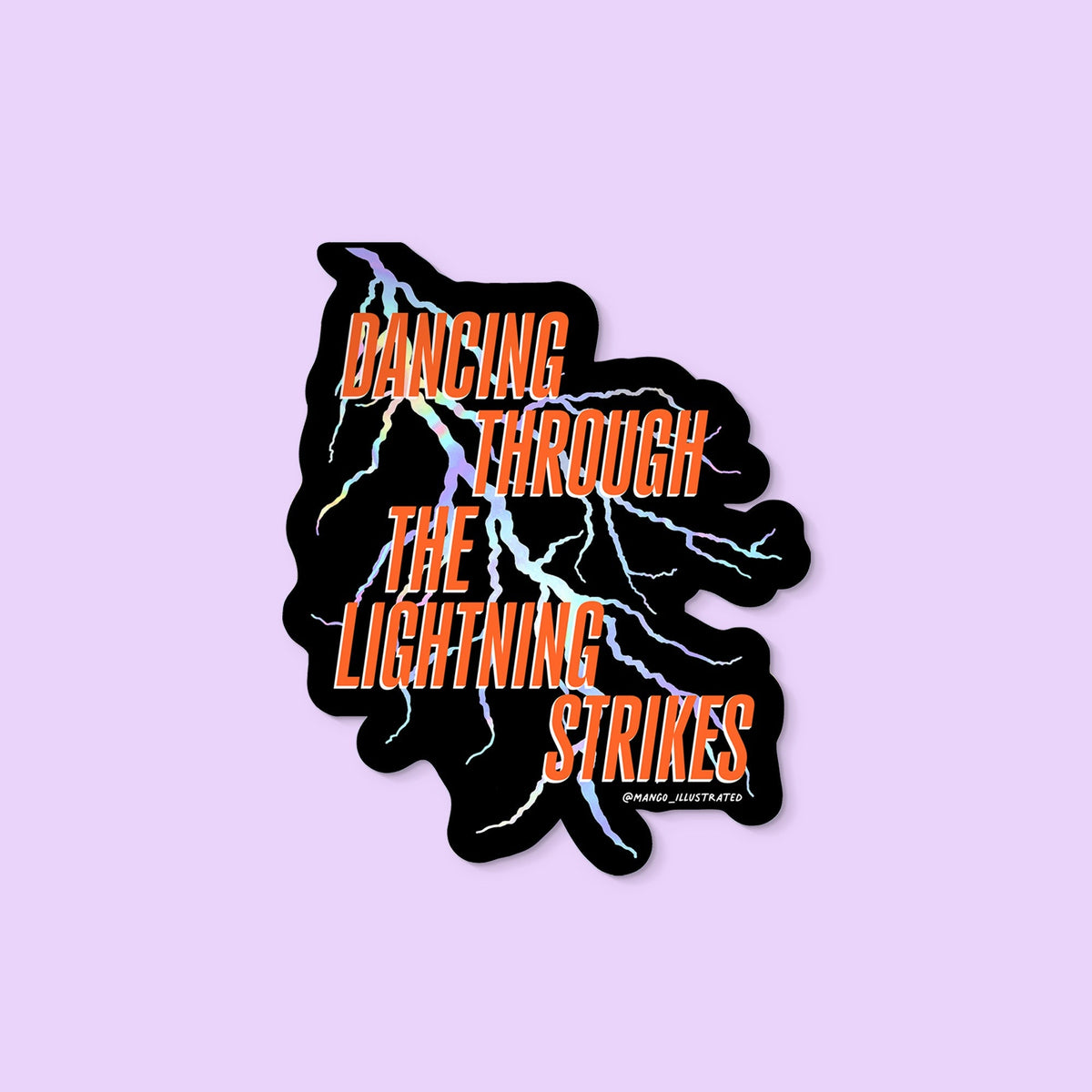 Dancing Through the Lightning Strikes sticker flat lay — holographic waterproof vinyl lightning bolt sticker for laptops and water bottles by indie artist MangoIllustrated