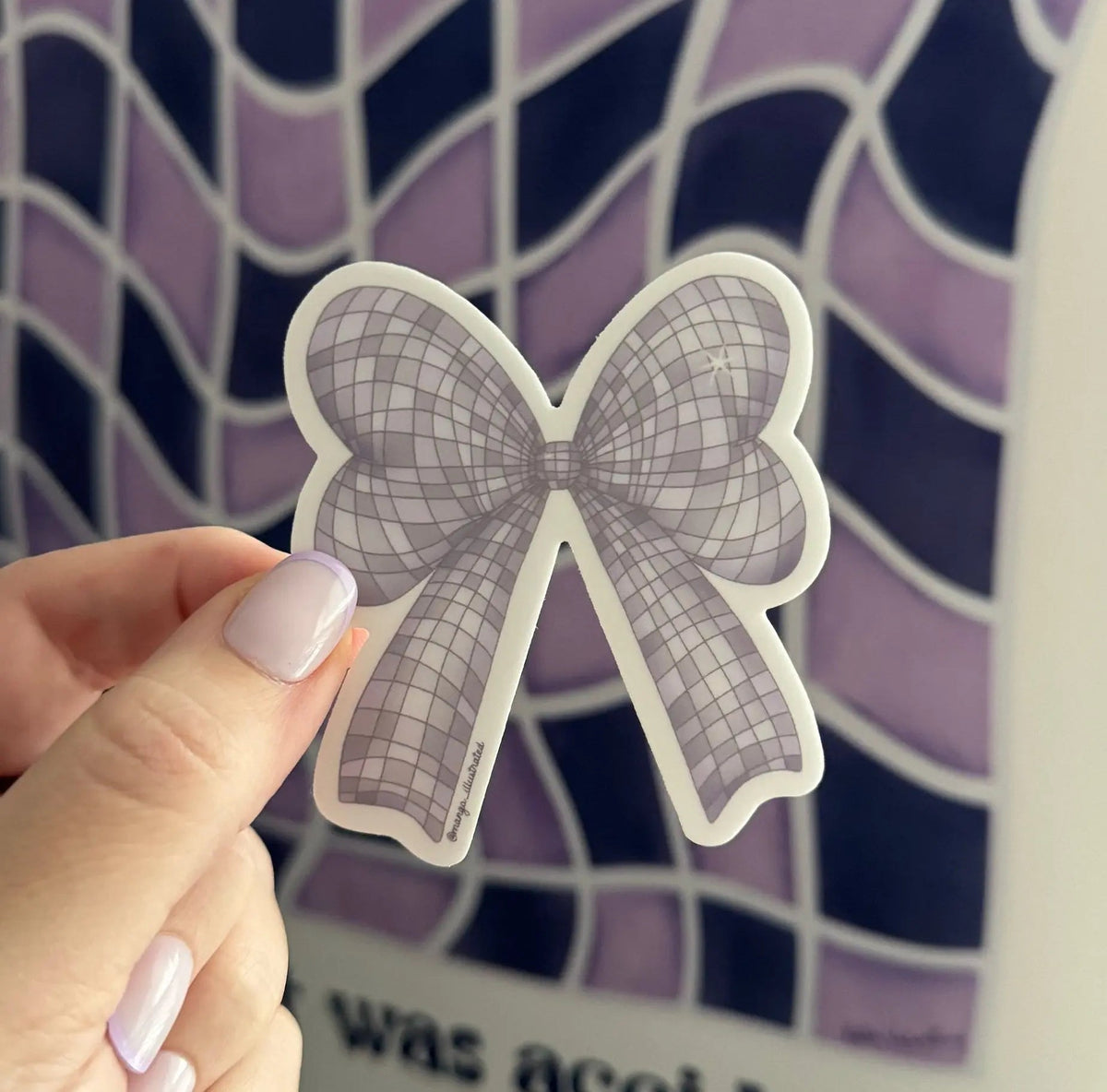 Disco Bow sticker styled flat lay — kindle and laptop sticker by indie artist MangoIllustrated