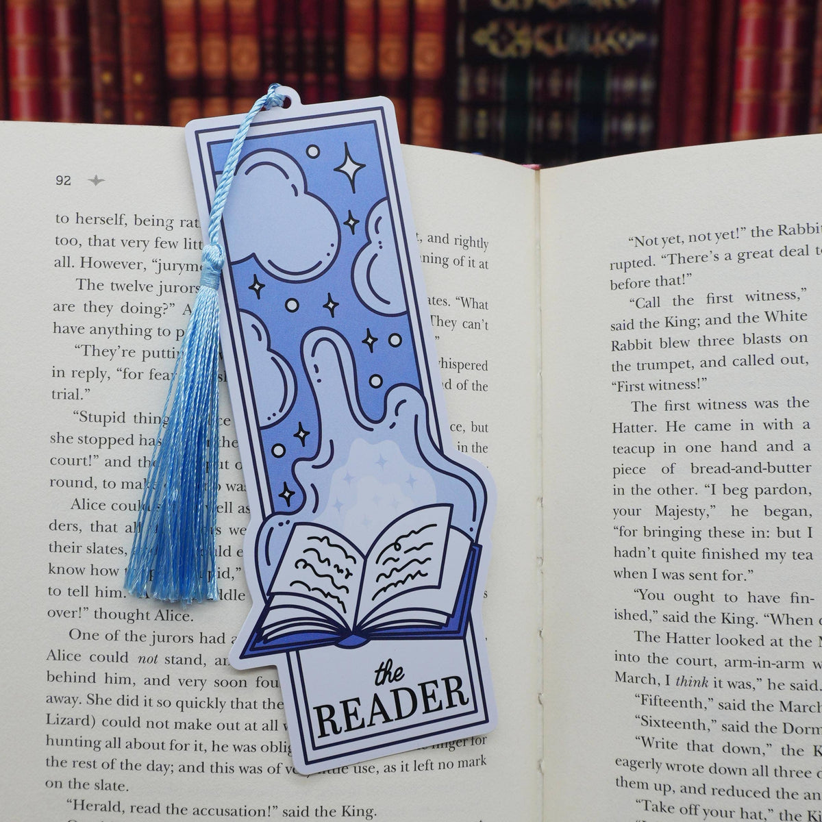 Blue bookmark with tassel on an open book
