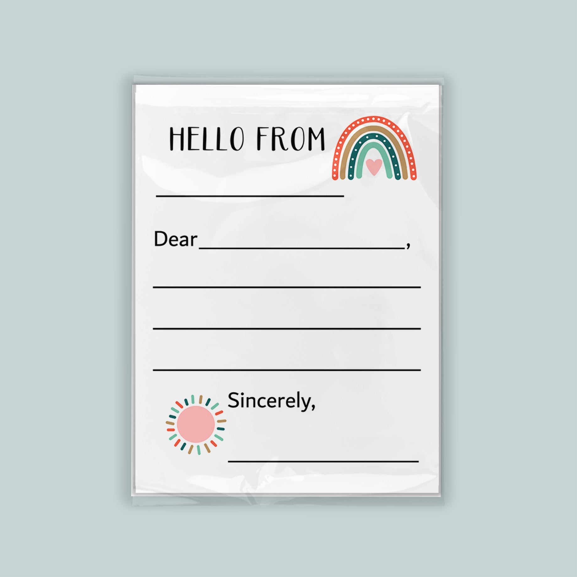 The image is a blank letterhead with a rainbow graphic and a heart symbol, inviting the recipient to write a message.