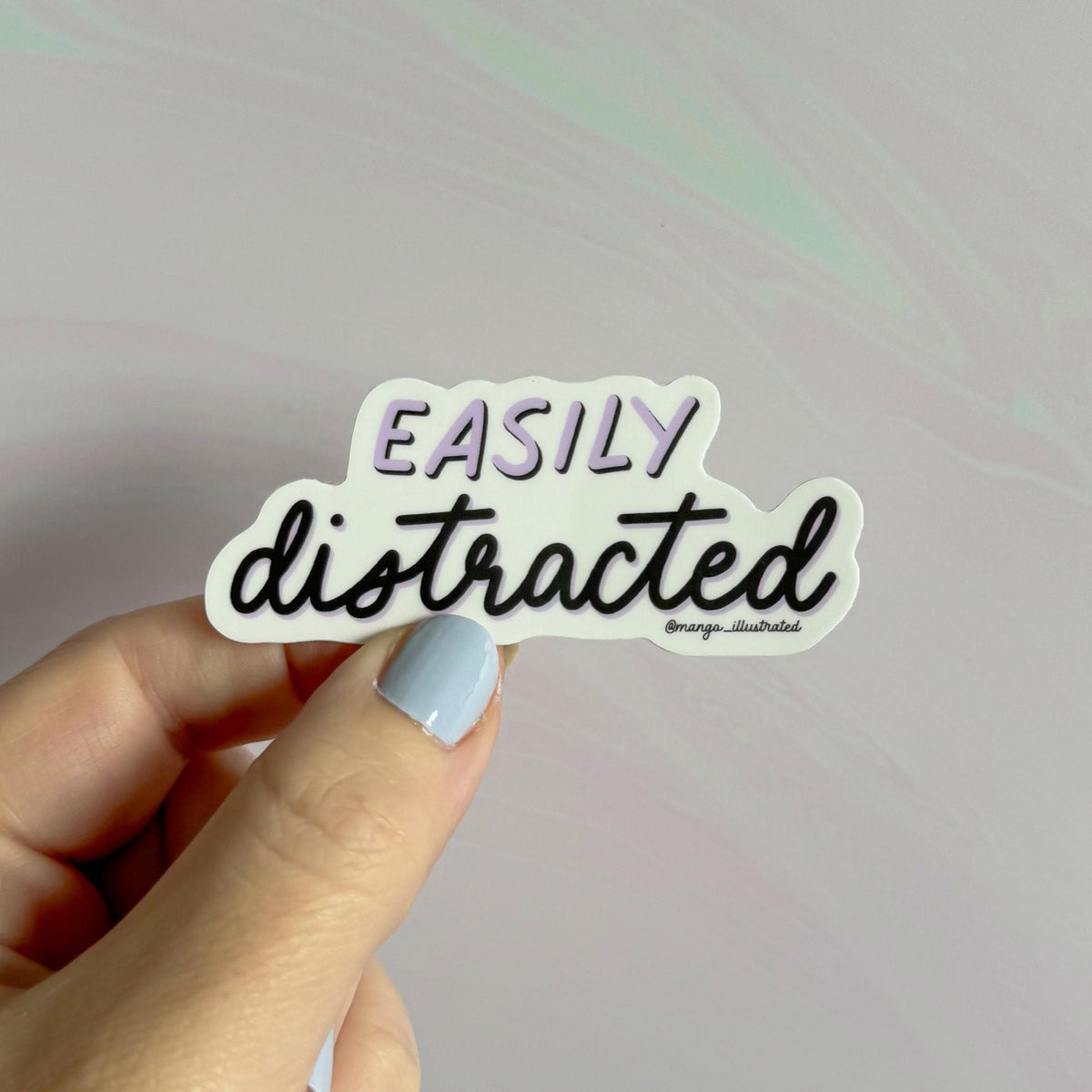 Easily distracted sticker detail — close up of the mixed hand lettering by indie artist MangoIllustrated