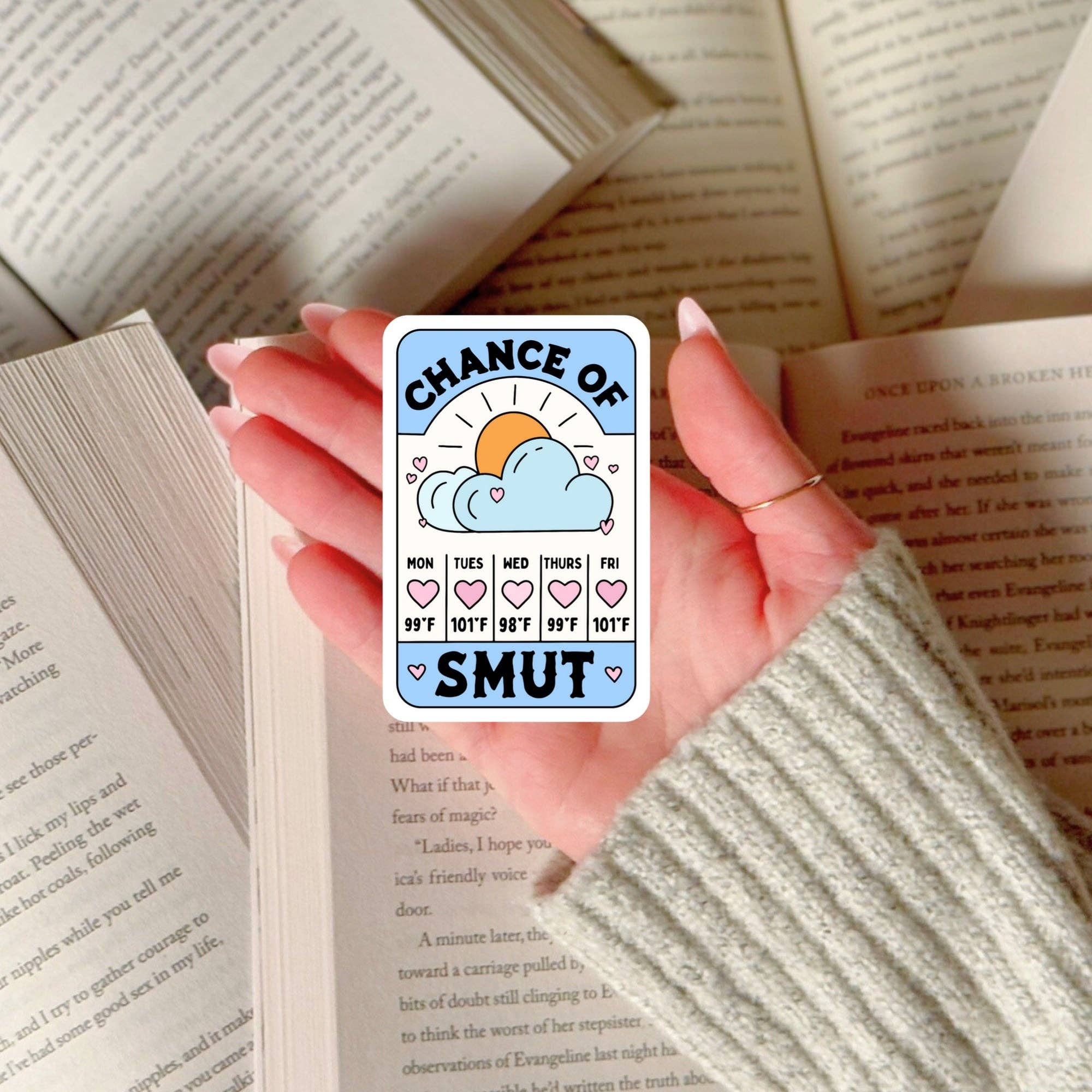 Hand holding a card with &