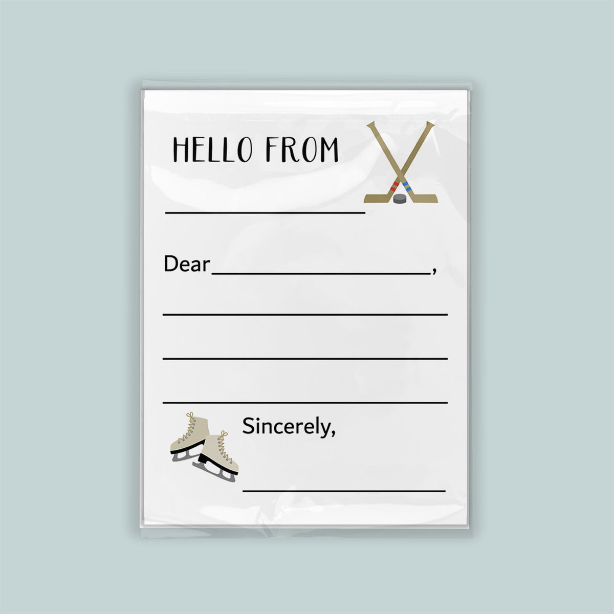 The image is a white envelope with a hockey stick and skates on the front, along with a blank greeting card space for a message.