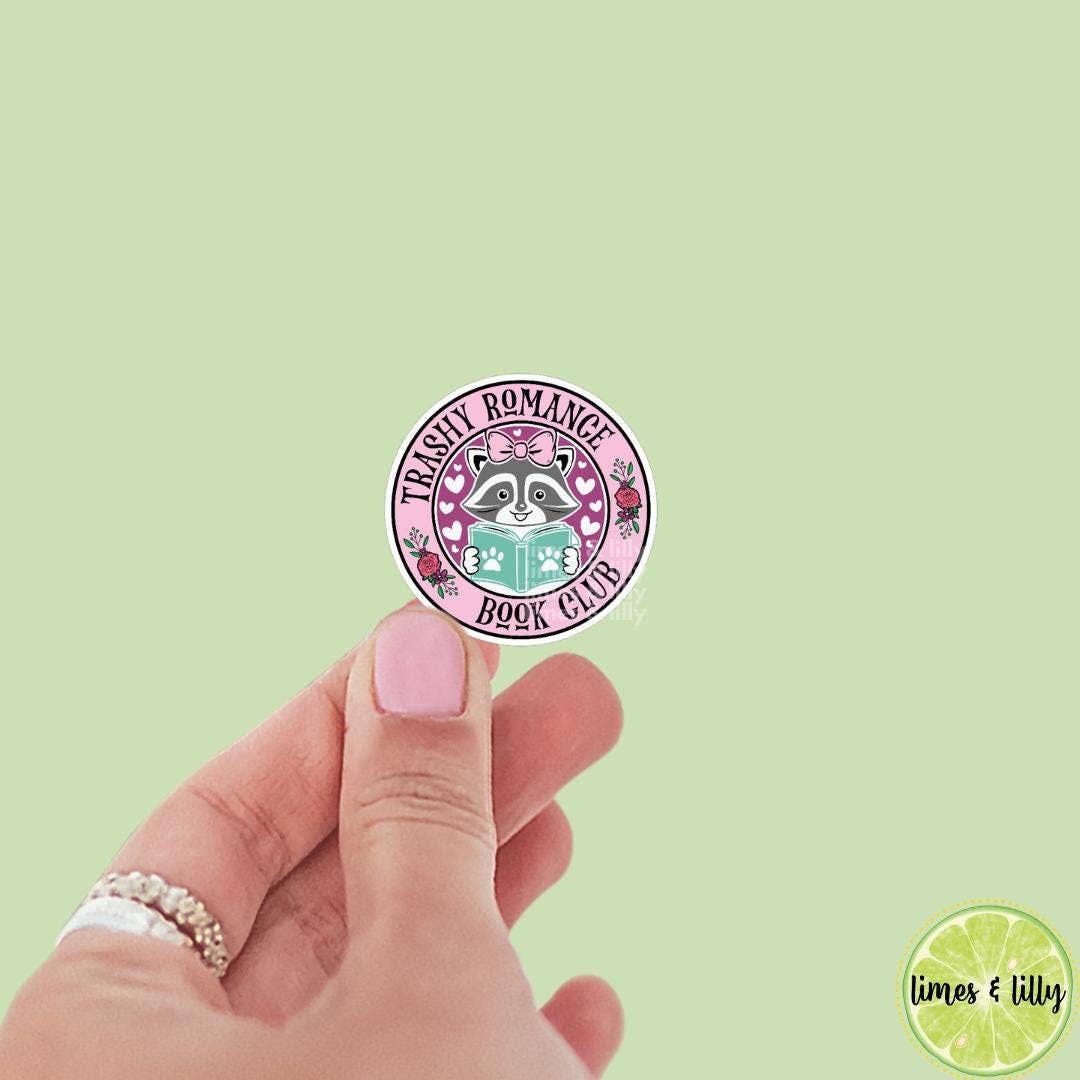 Hand holding a round sticker with &