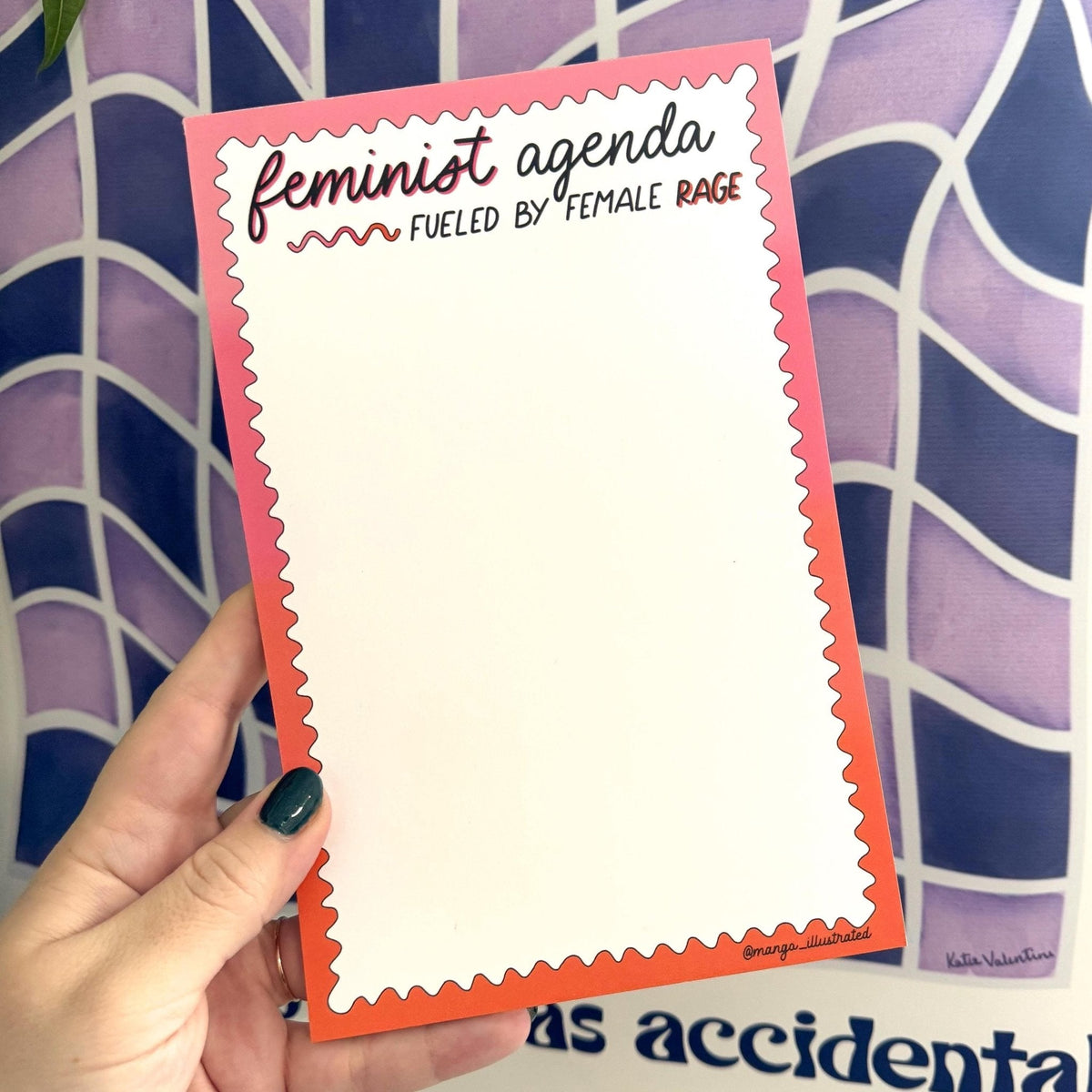 Feminist agenda notepad flat lay — pink and red gradient desk notepad by indie artist MangoIllustrated