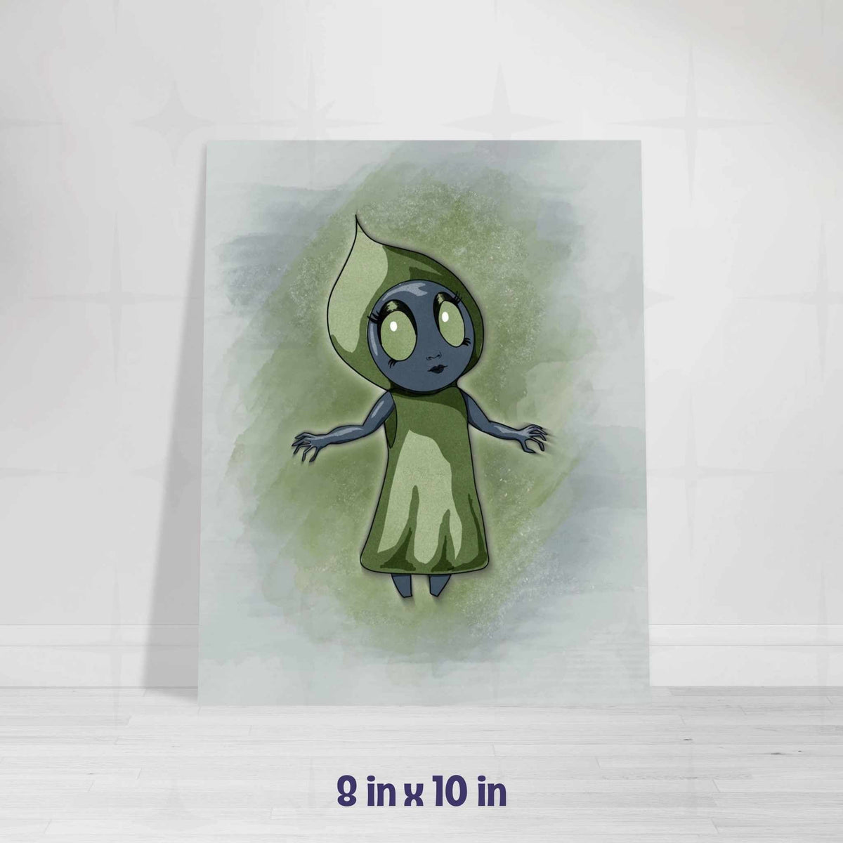 Flatwoods Monster art print in the 8x10 inch size, leaning against a navy blue wall on a light wood floor.