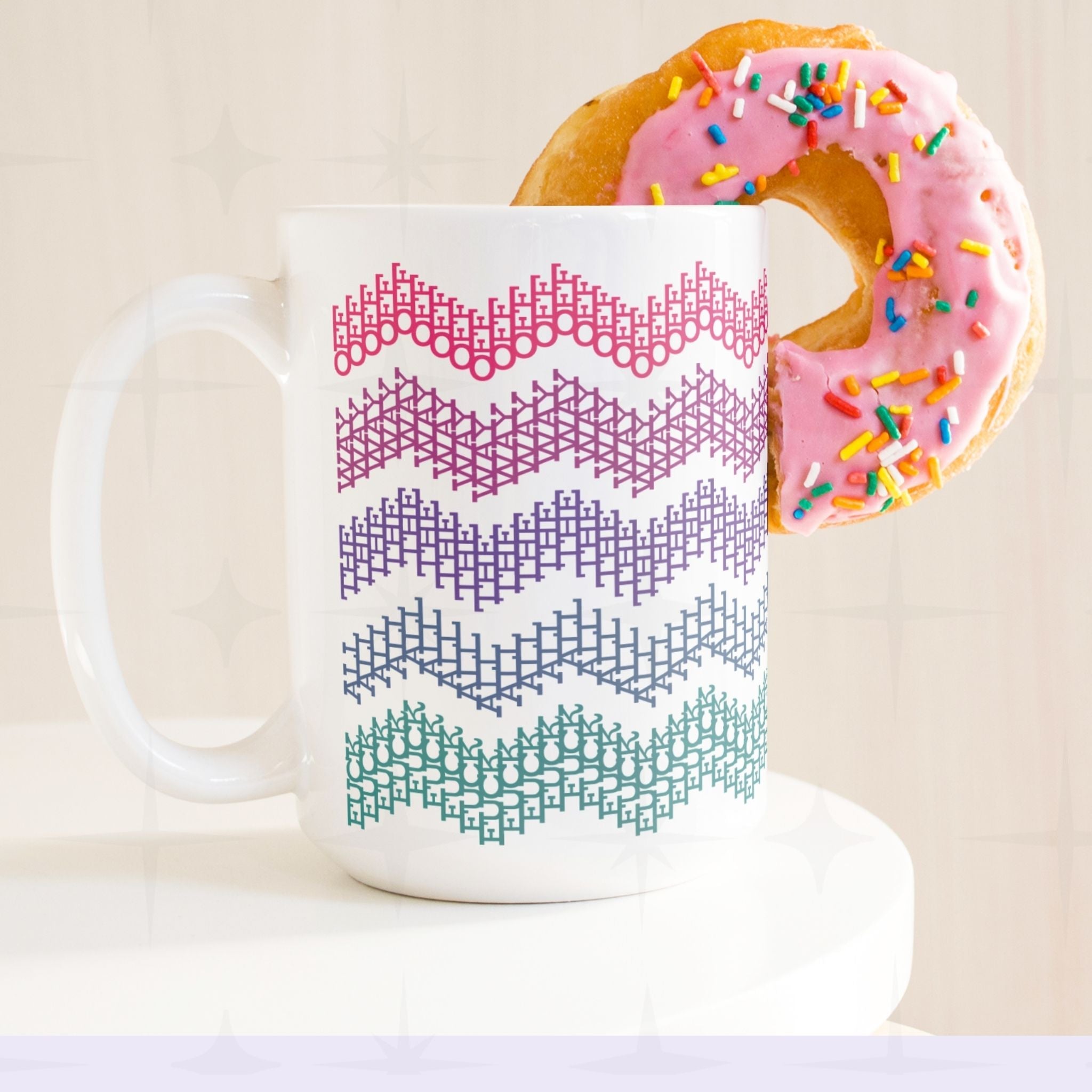 Bright stripes hidden profanity chevron mug in pink purple teal with a pink frosted donut balanced on the handle, retro styling