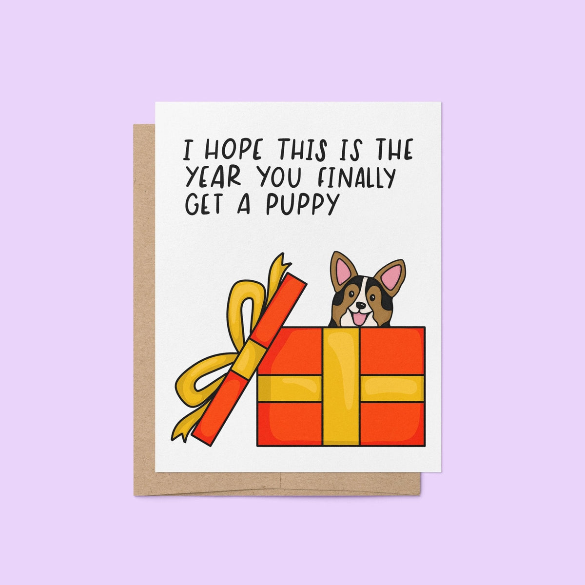Hope This Is the Year You Finally Get a Puppy holiday card with A2 kraft envelope — puppy gift box illustration by indie artist MangoIllustrated