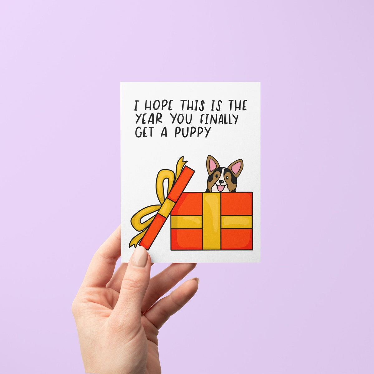 Hope This Is the Year You Finally Get a Puppy holiday card flat lay — funny Christmas card for dog lovers by indie artist MangoIllustrated