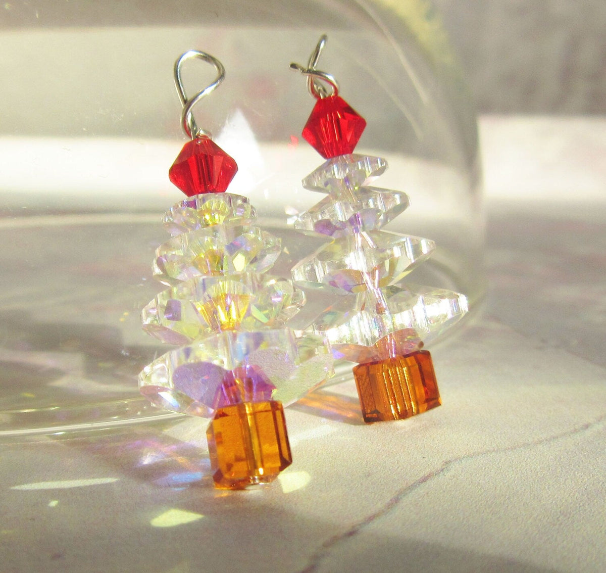 Crystal Christmas Tree Earrings - Sterling Silver, Holiday Jewelry: Stacked clear beads, red star topper, and orange trunk sparkle in sunlight. Hypoallergenic and festive—ideal for anyone seeking cheerful holiday earrings.