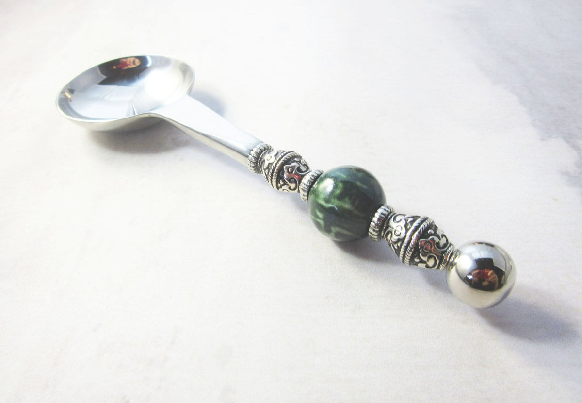 The Green Stone Scoop & Table Spoon Gift Set features a handcrafted scoop with an ornate handle and a large dark green bead—ideal as a unique tea, coffee, bath salt, or herbal supplement measure spoon for enthusiasts.