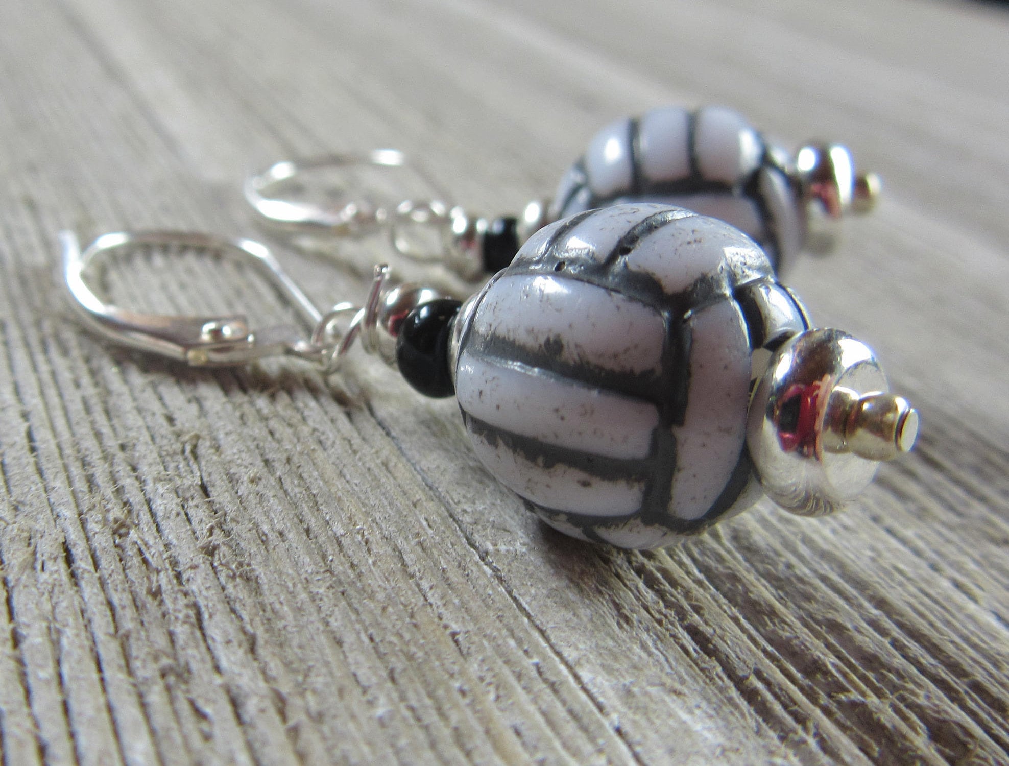 Stylish pair of volleyball earrings - Sport Ball Jewelry with secure lever back for comfortable wear during games.