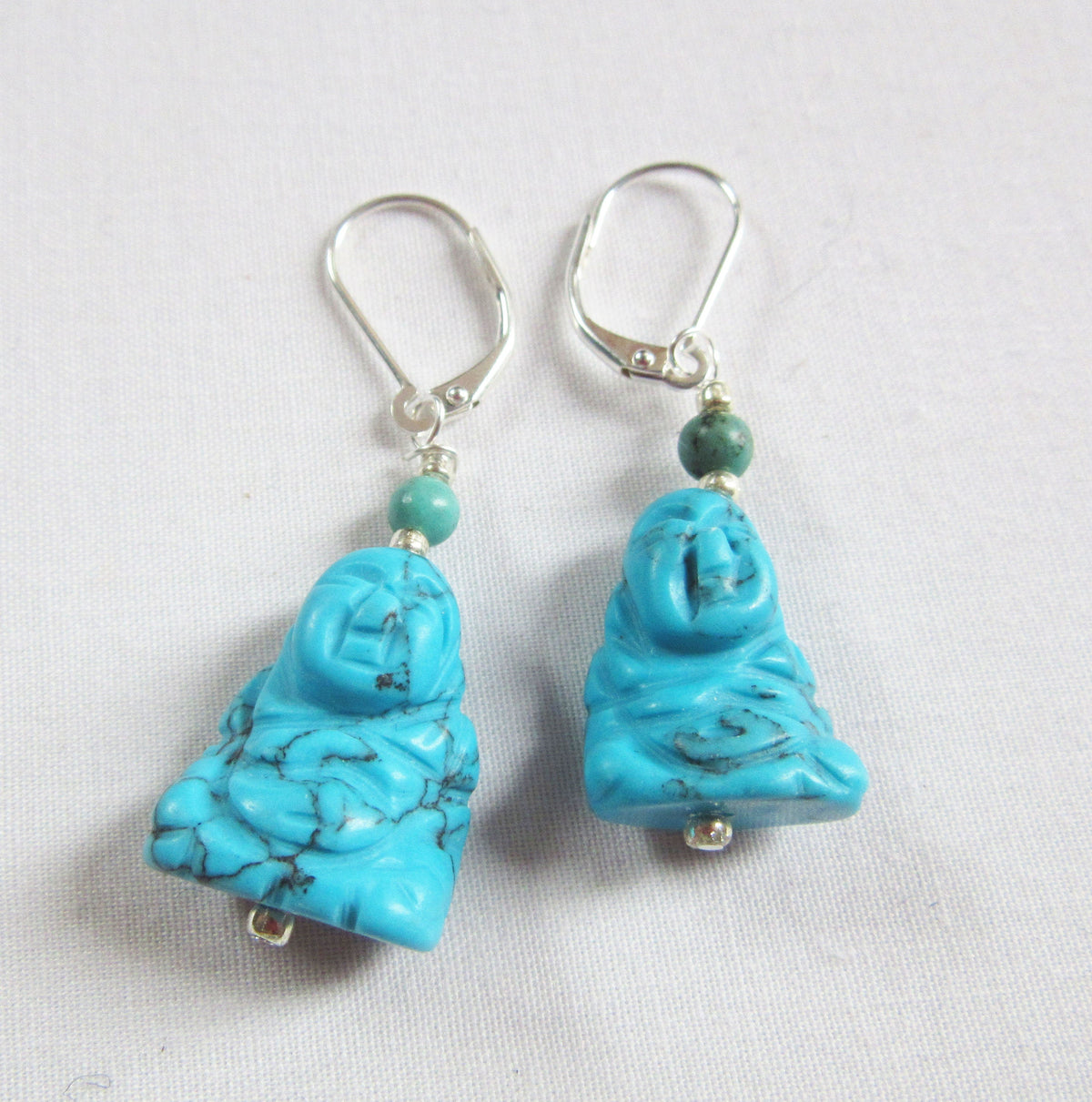 Smiling Happy Man Zen Earrings featuring carved howlite and turquoise stones, perfect gifts for her.