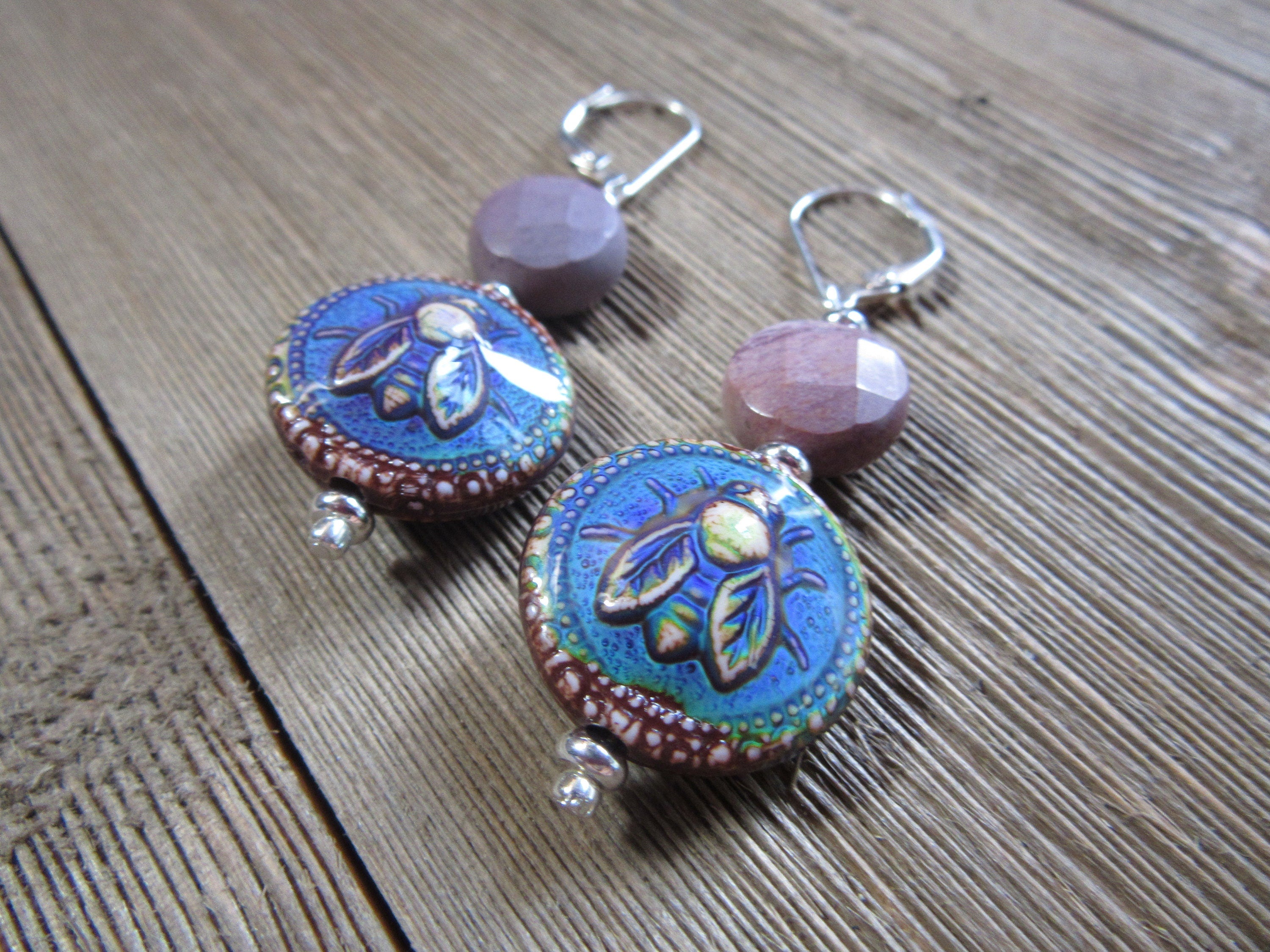 Close-up view of Bee Earrings with Natural Stone Moukite Accent Bead, displaying vibrant colors of the mood bead and elegant design.