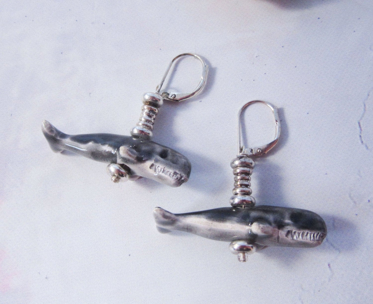 Close-up of hand-painted Sperm Whale Earrings, exotic animal gift perfect for sea animal science enthusiasts.