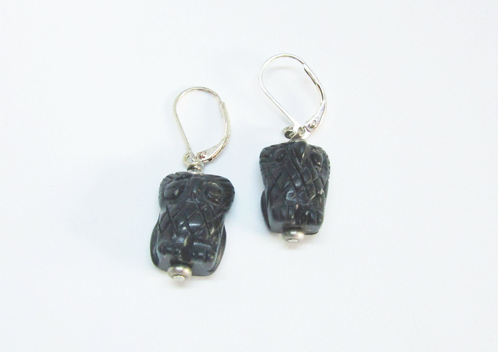 Close-up of Woodland Earrings, showcasing the intricate carvings of owl jewelry for women.
