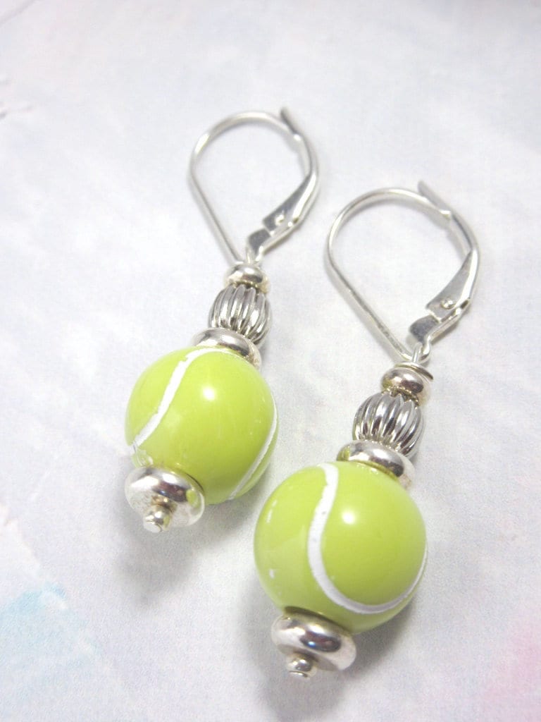Stylish Tennis Ball Earrings with white stitching, ideal for women who love tennis, from Enlivenadorn by Gwynstone.