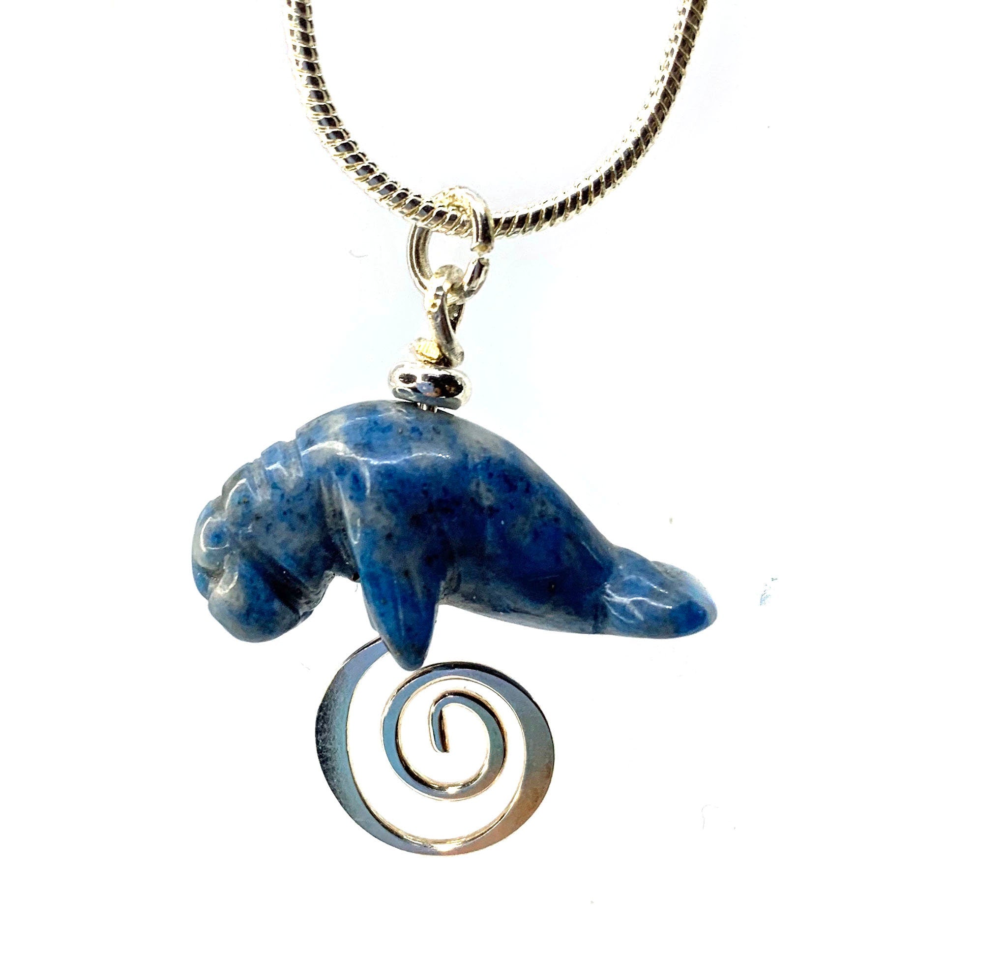 Manatee Blue Necklace with carved sodalite animal pendant, a stunning piece of jewelry representing beach lovers.