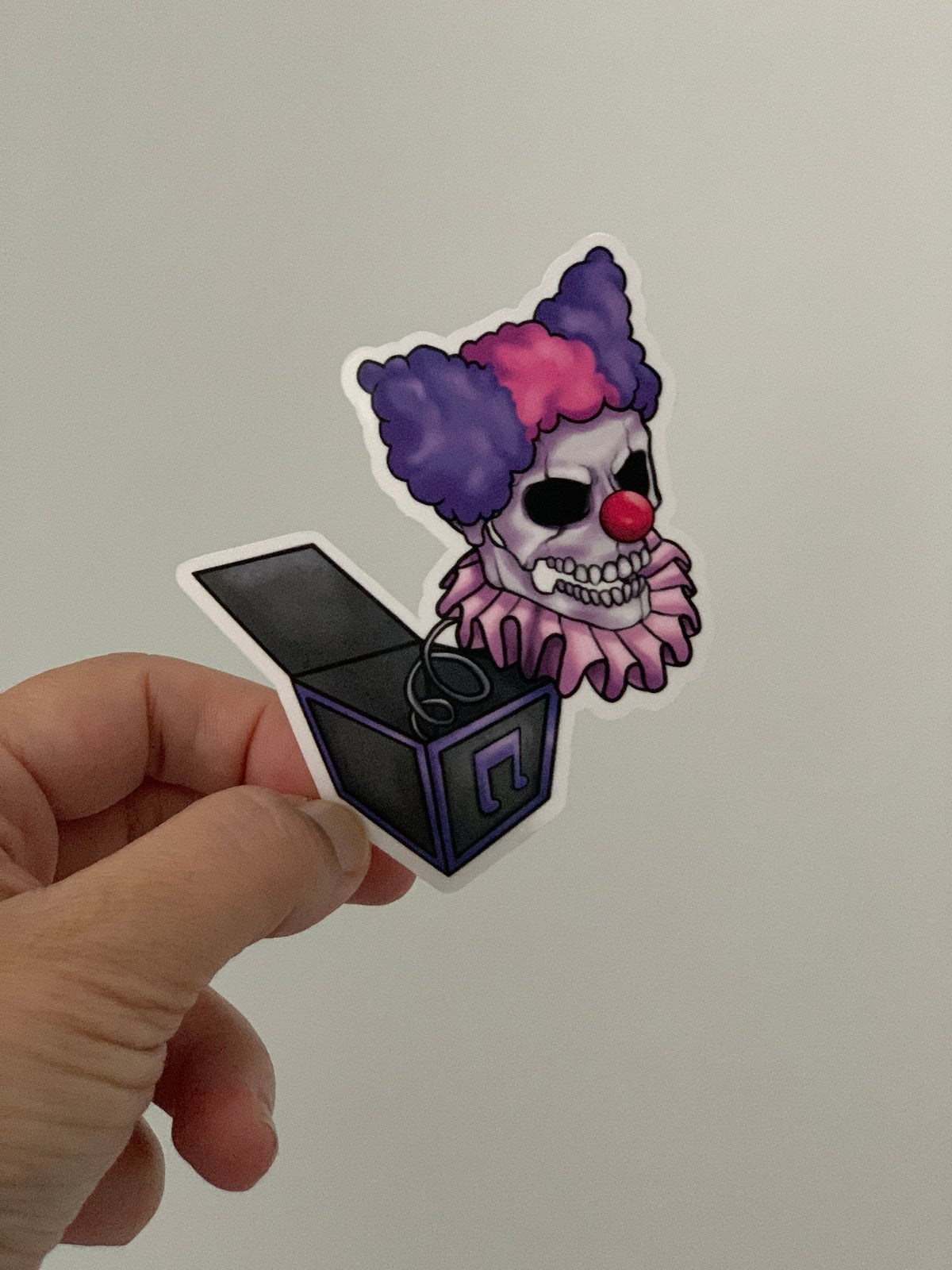 Purple creepy clown sticker
