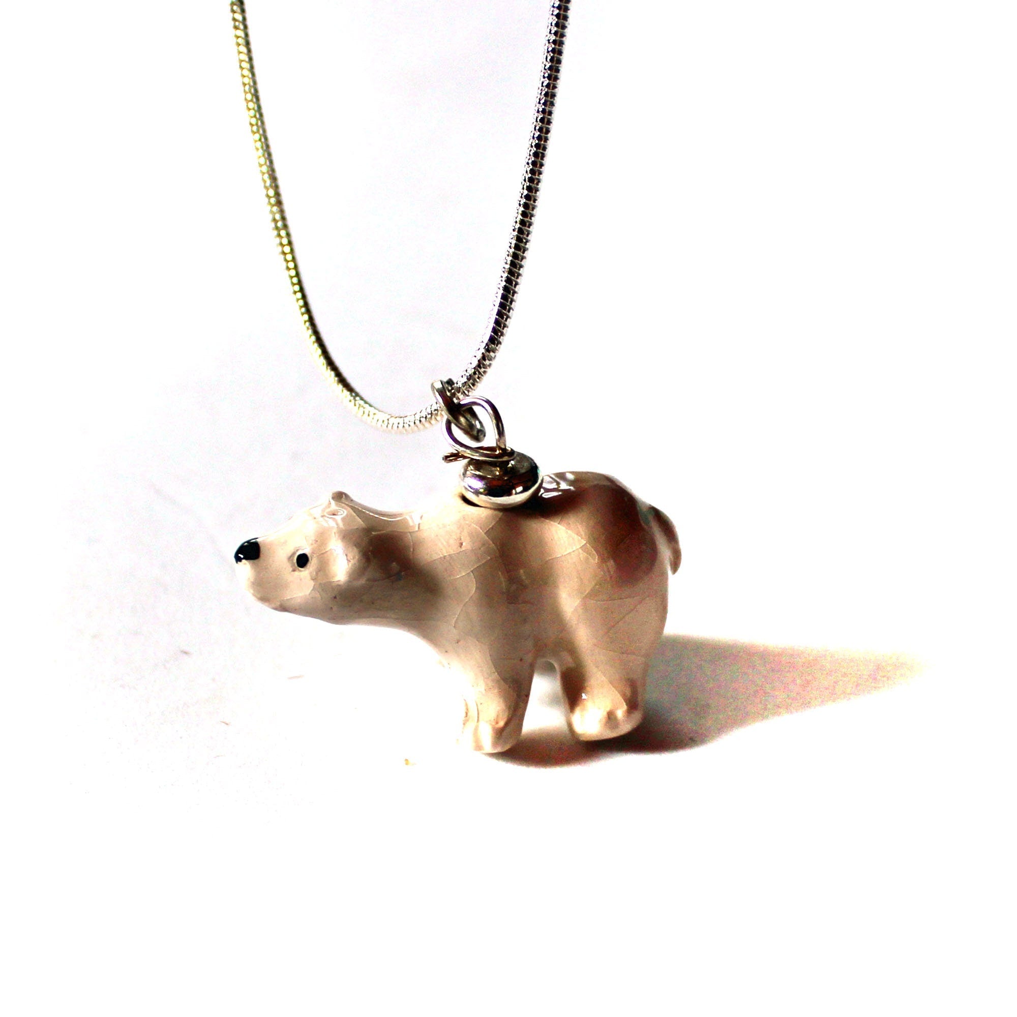 Close-up view of the North Polar Bear necklace showcasing its intricate hand-painted details, ideal for gifting.