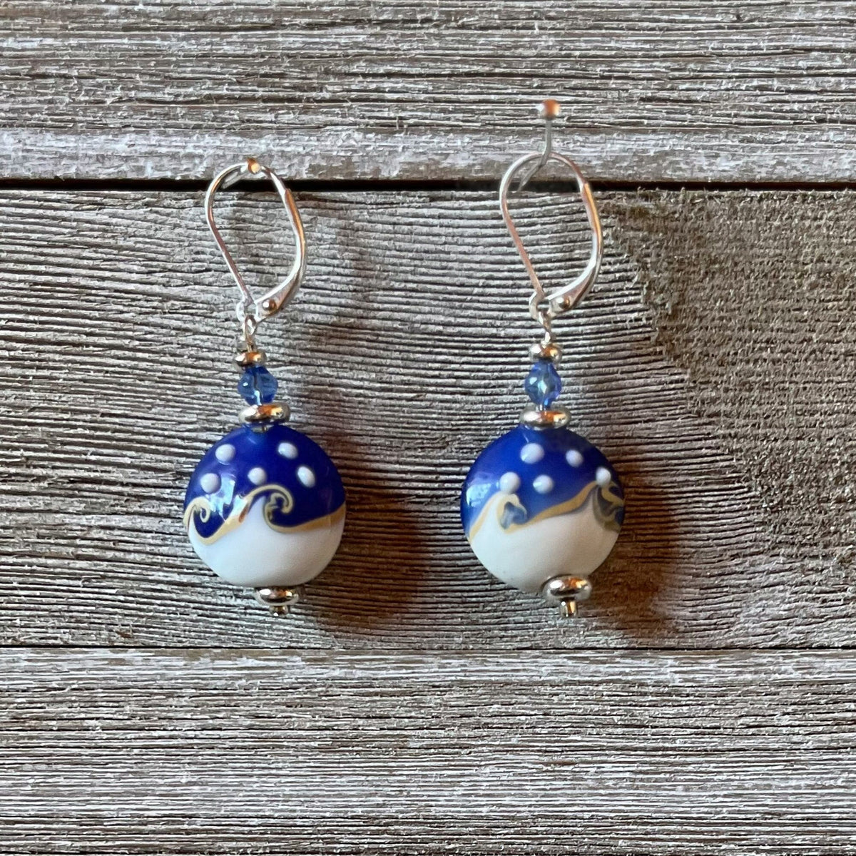 Ocean Wave Earrings say Hello - beautiful lamp worked glass earrings designed for ocean lovers, featuring blue and white swirls that mimic the ocean.