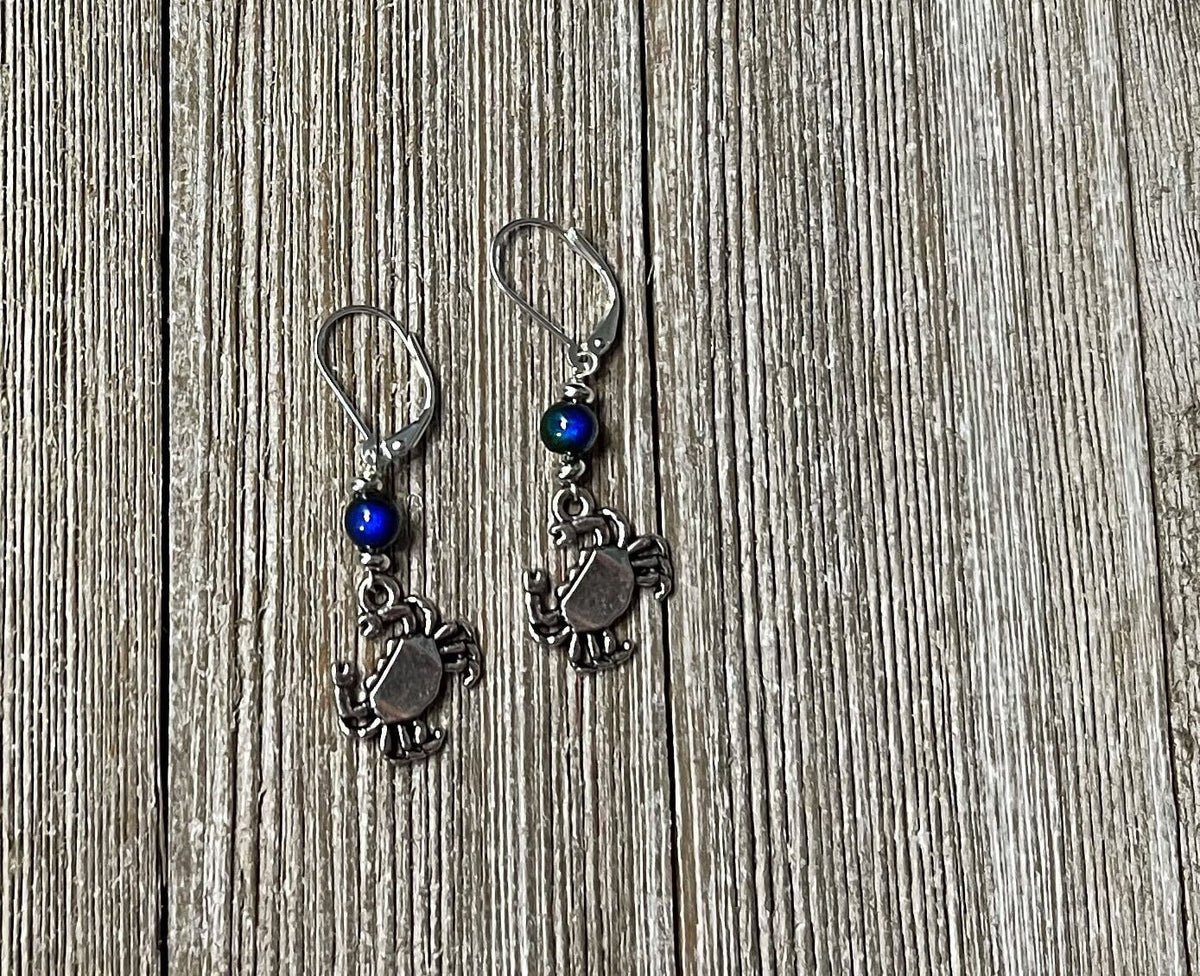 Detail of Color Changing Crab Dangle Earrings, featuring unique craftsmanship and ocean-themed elements.