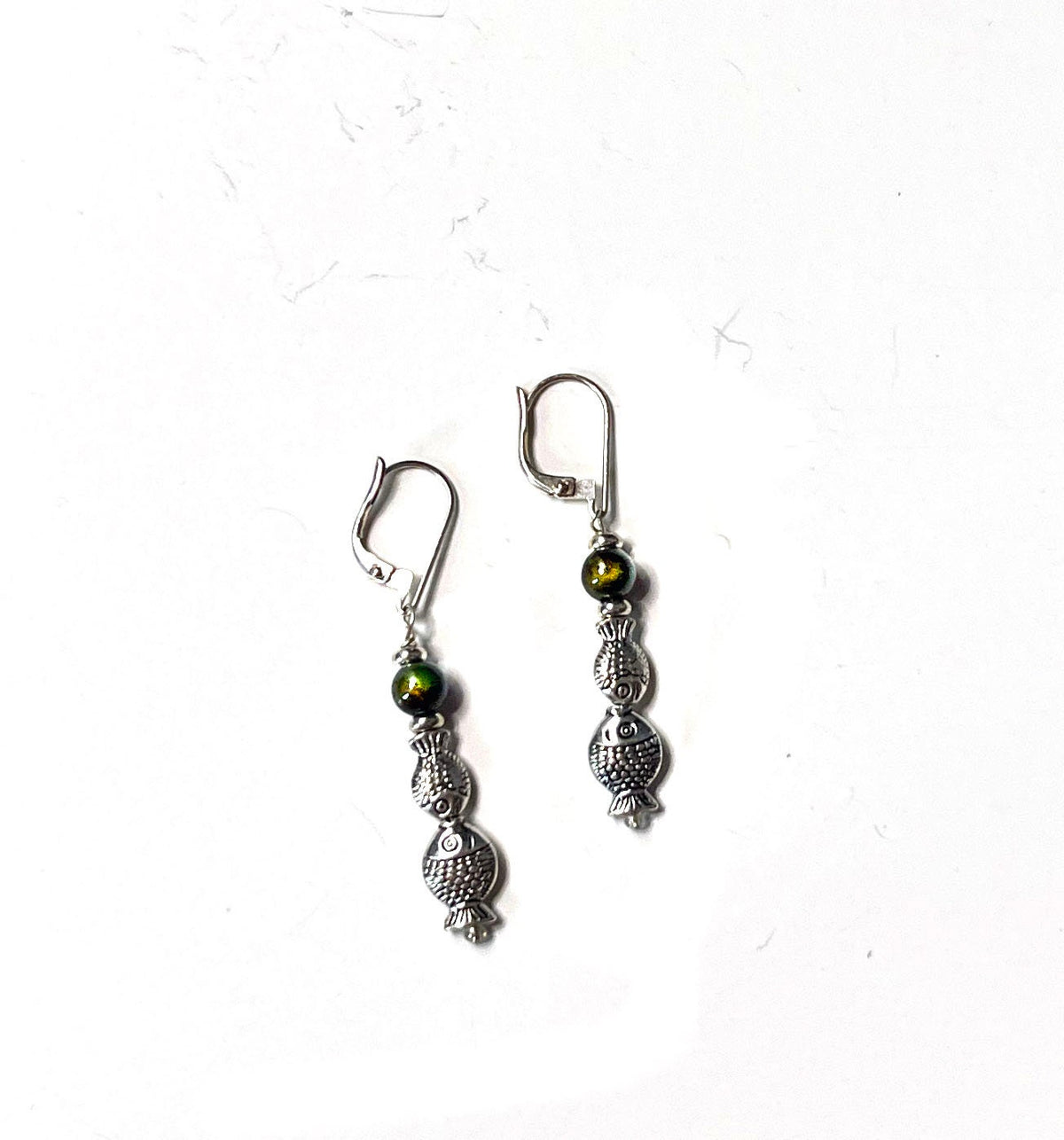 Color Changing Fish Dangle Earrings displayed on a stylish background, handmade by Gwynstone, perfect for water enthusiasts.
