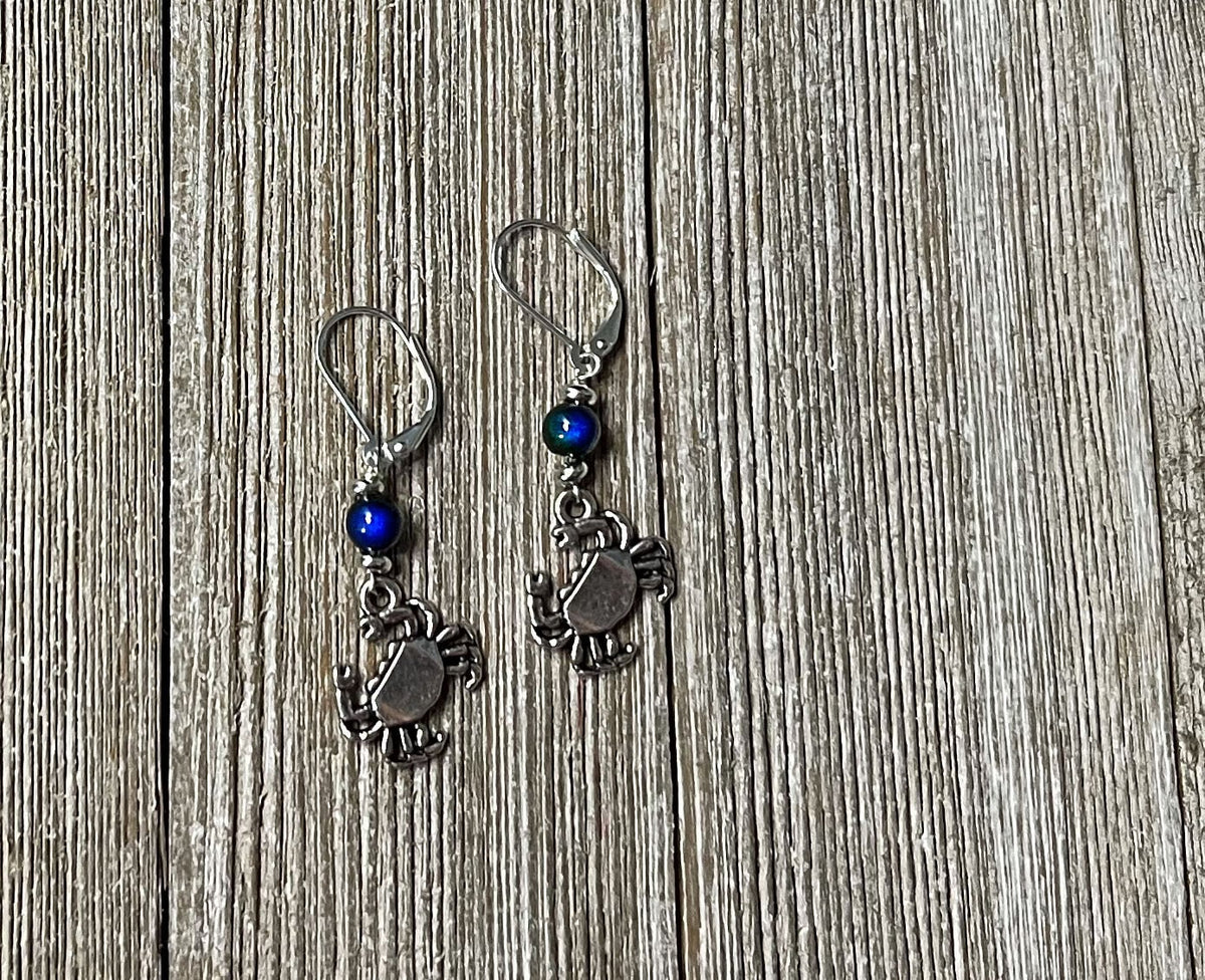 Color Changing Crab Dangle Earrings worn by a model, illustrating their cute and playful style for ocean lovers.